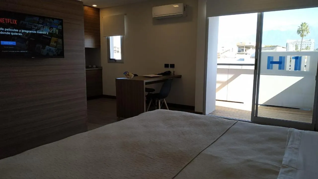 Bed in H1 Apartments Hotel