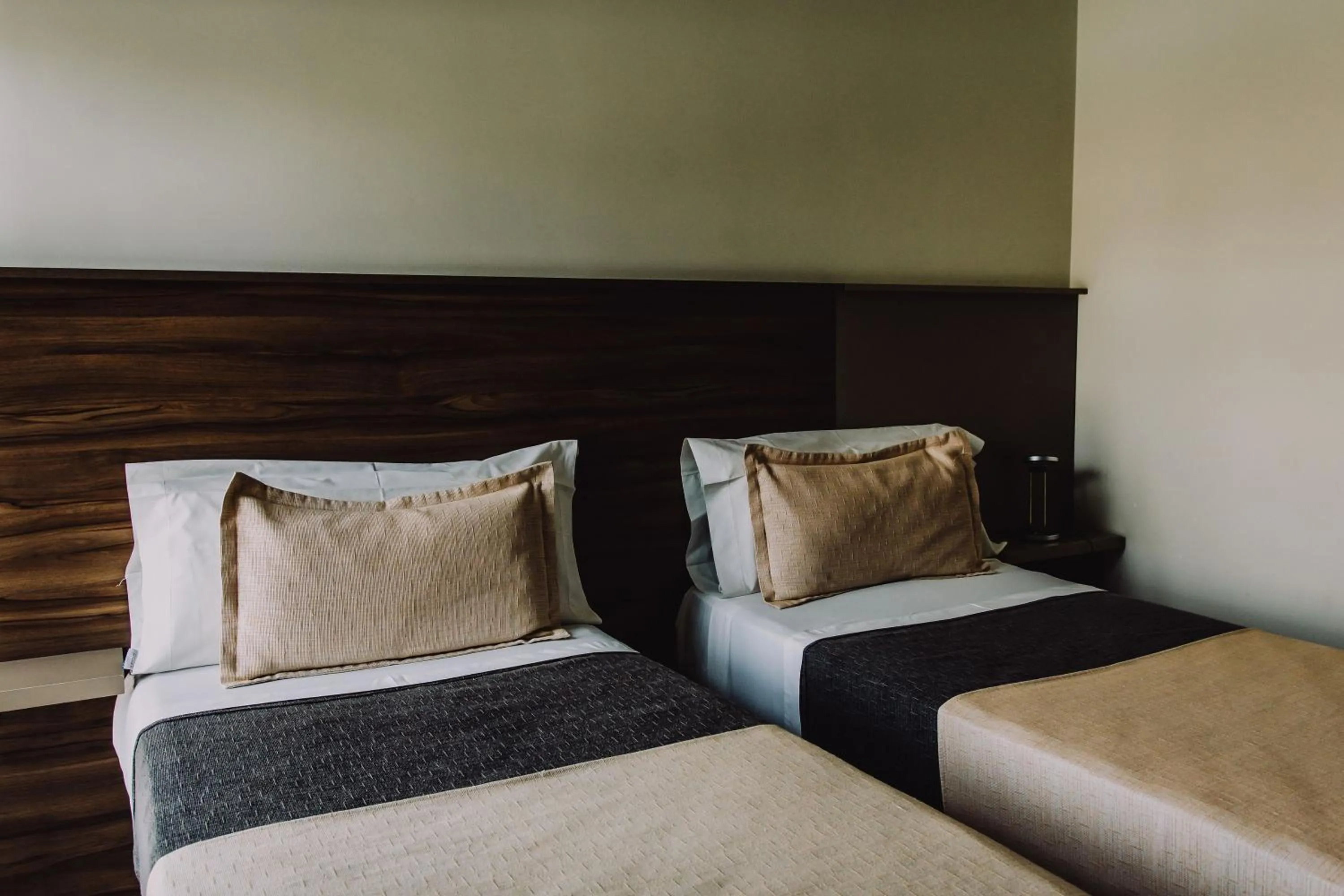 Bed in H1 Apartments Hotel