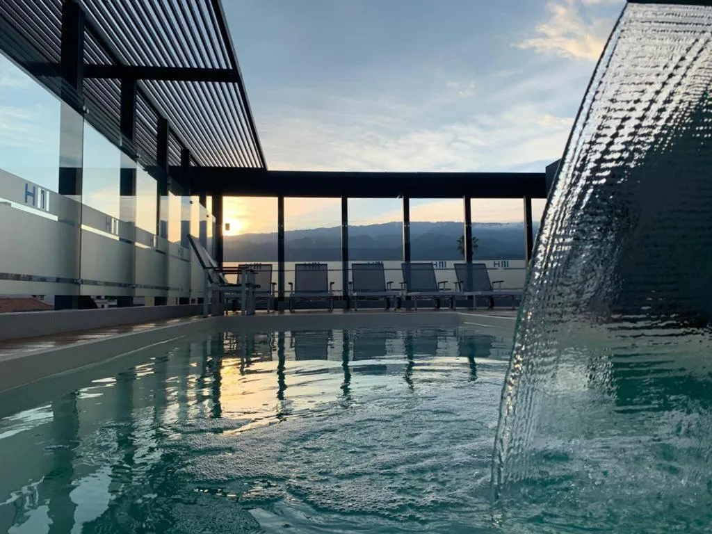 Swimming pool in H1 Apartments Hotel