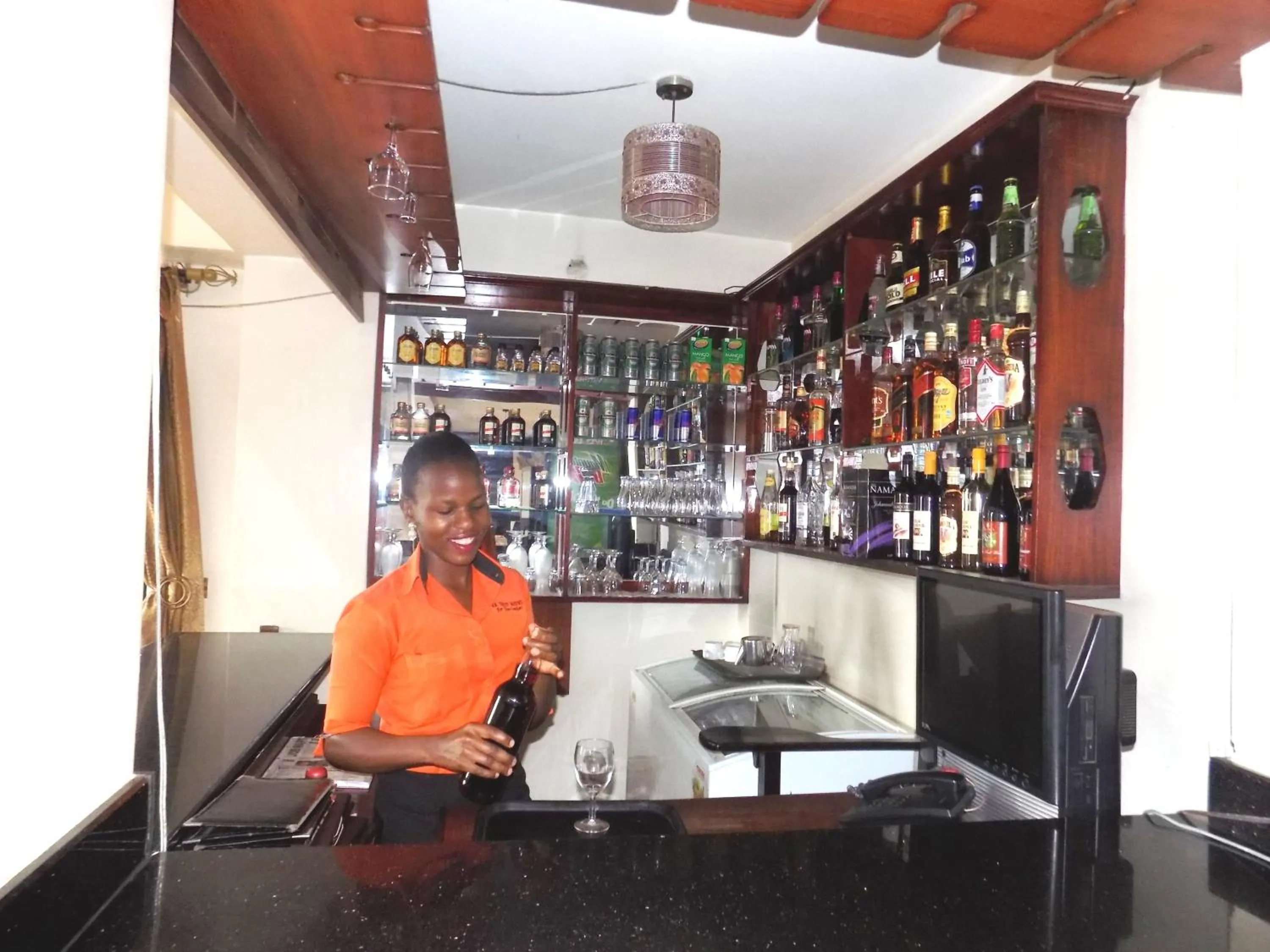 Lounge or bar in KK Trust Hotel Kampala