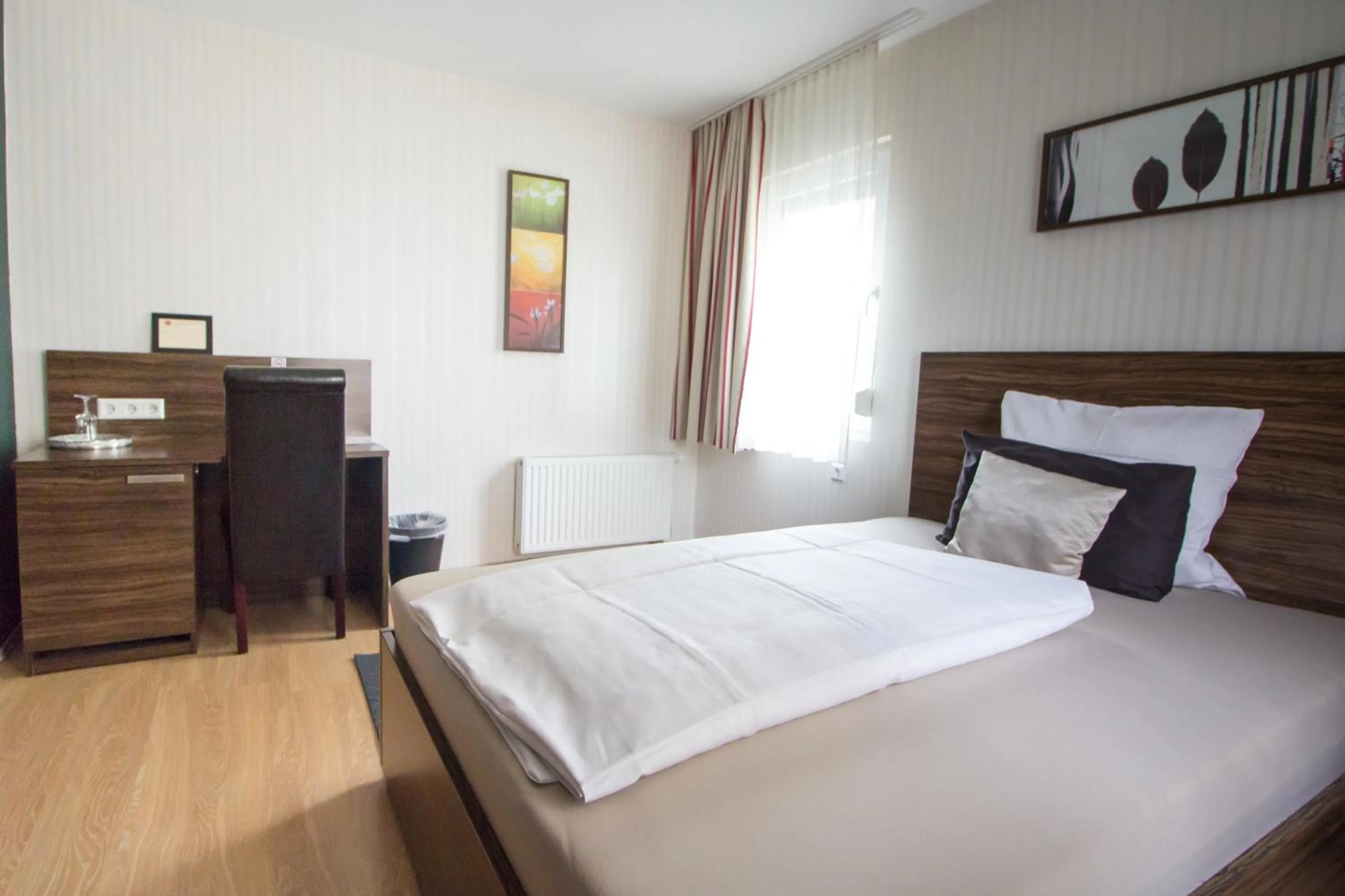 Photo of the whole room, Bed in Landhotel Wolfschlugen