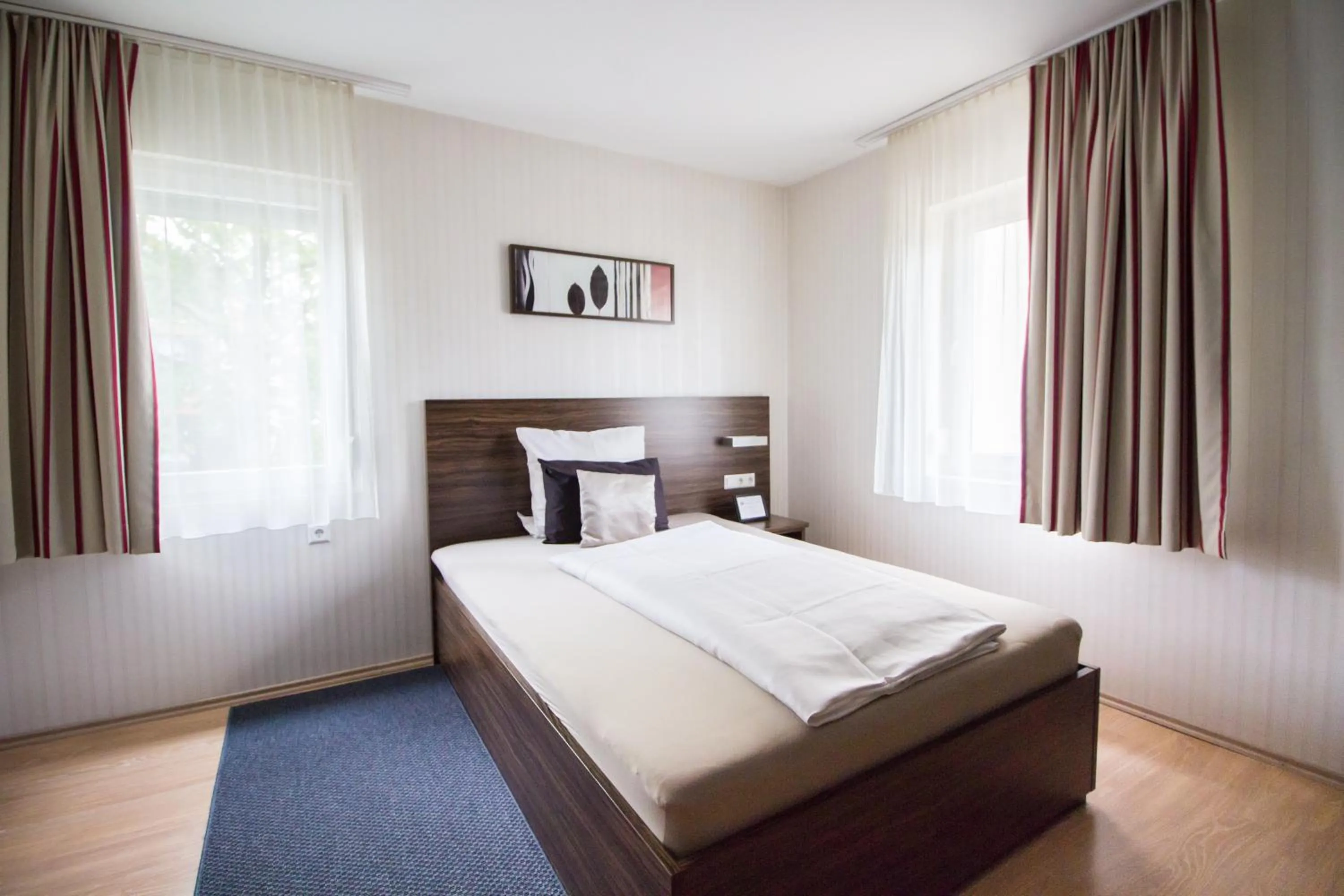 Photo of the whole room, Bed in Landhotel Wolfschlugen