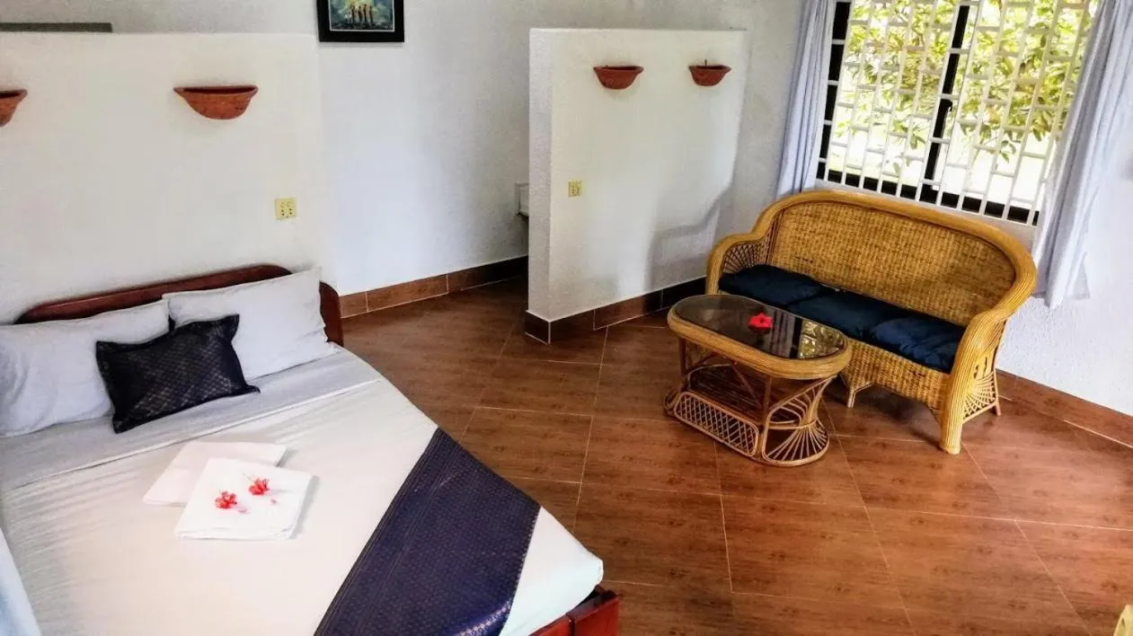 Living room, Bed in Q Bungalows