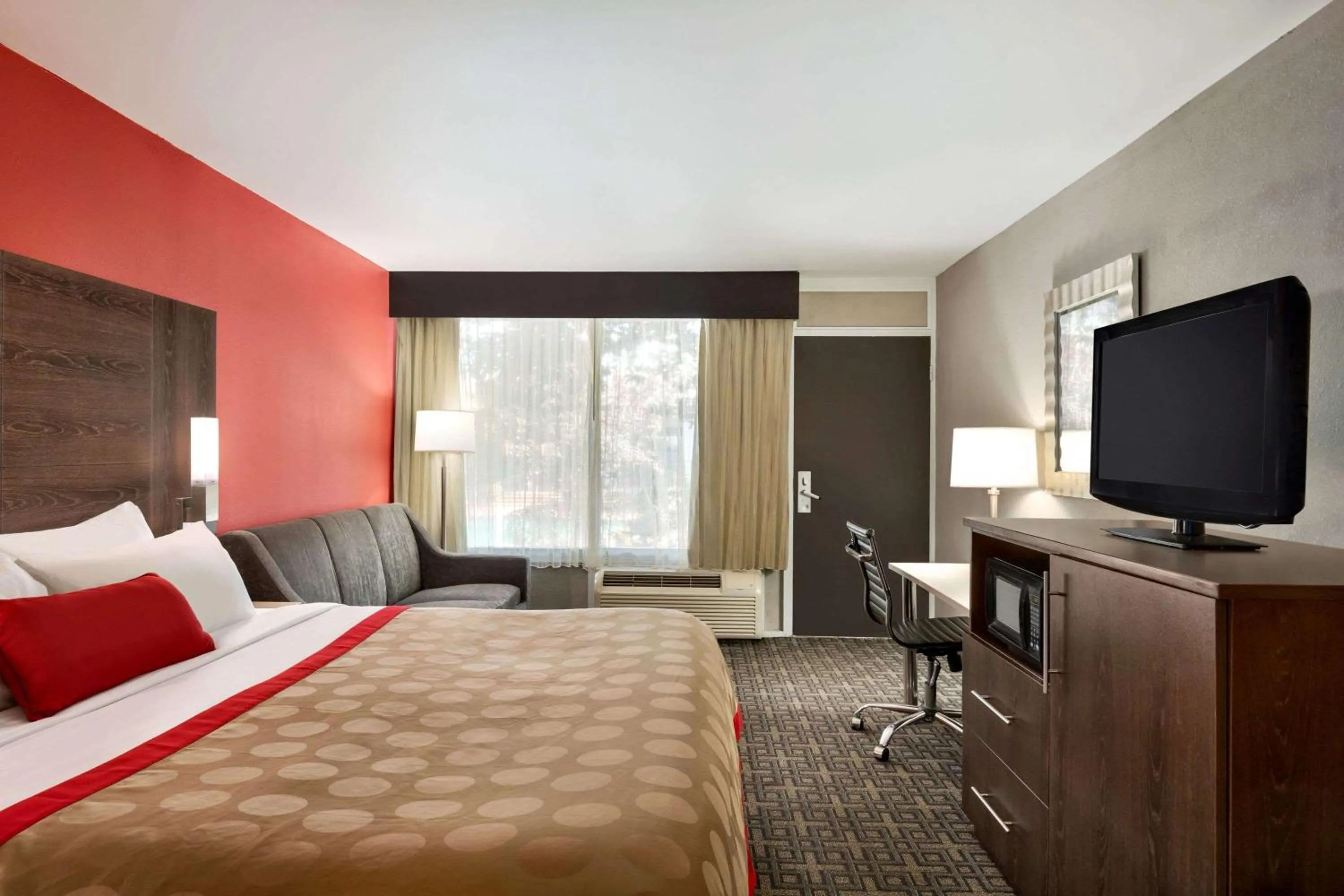 Photo of the whole room, TV/Entertainment Center in Ramada by Wyndham Augusta Fort Gordon