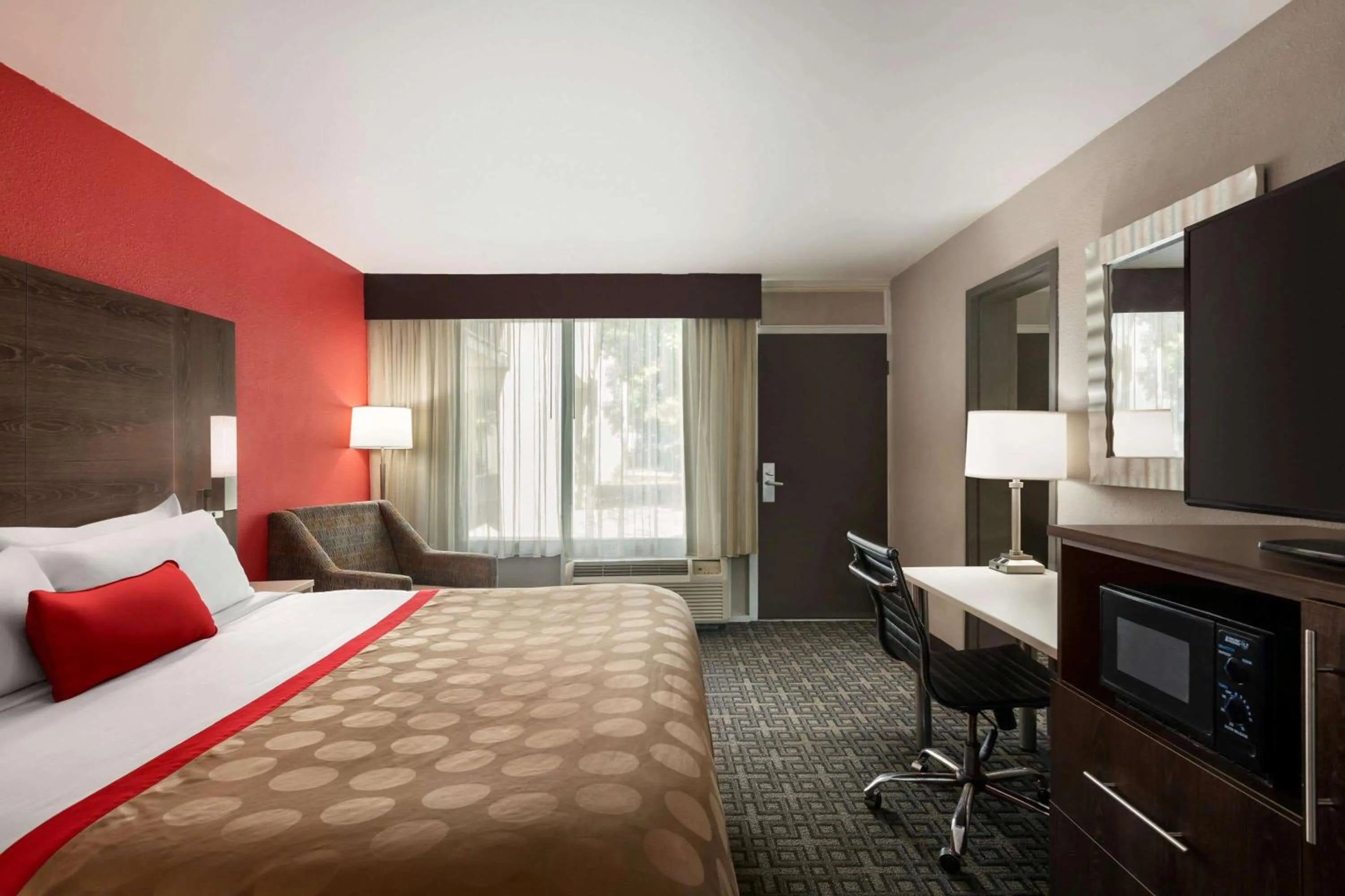 Photo of the whole room, TV/Entertainment Center in Ramada by Wyndham Augusta Fort Gordon