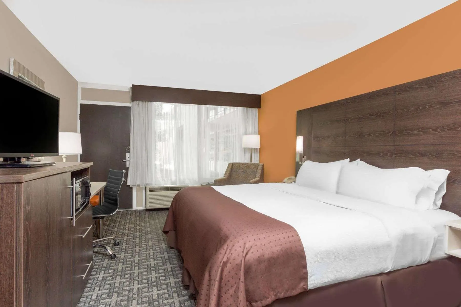 Bedroom, TV/Entertainment Center in Ramada by Wyndham Augusta Fort Gordon