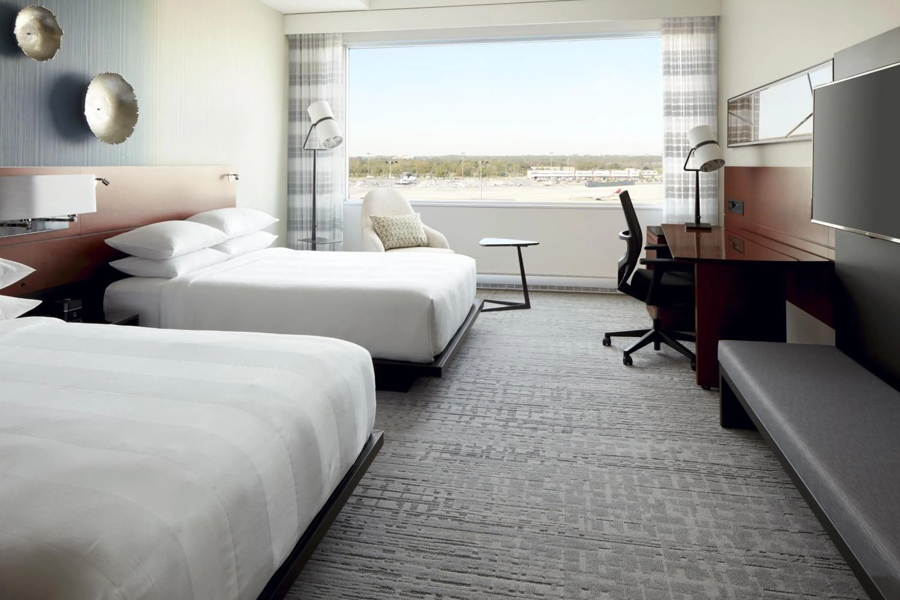 Photo of the whole room, Bed in Marriott Montreal Airport In-Terminal Hotel