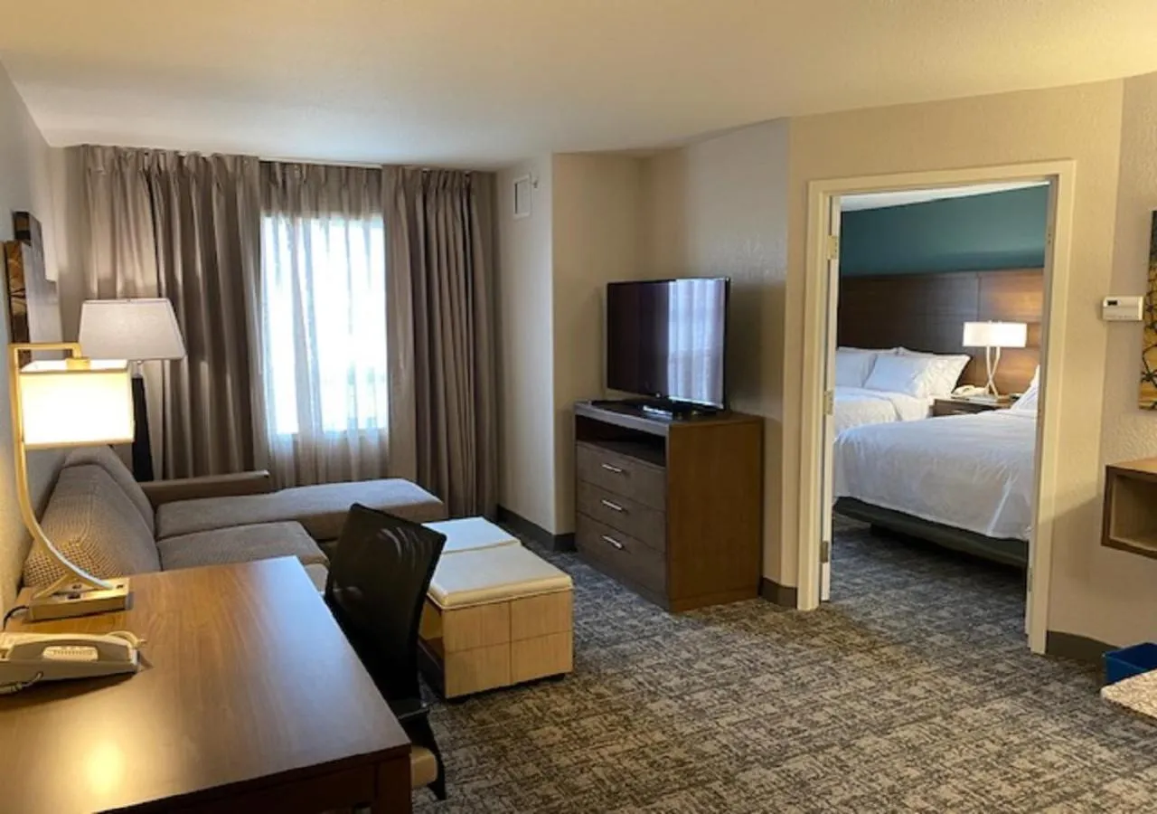 Living room, Bed in Staybridge Suites - Calgary Airport by IHG