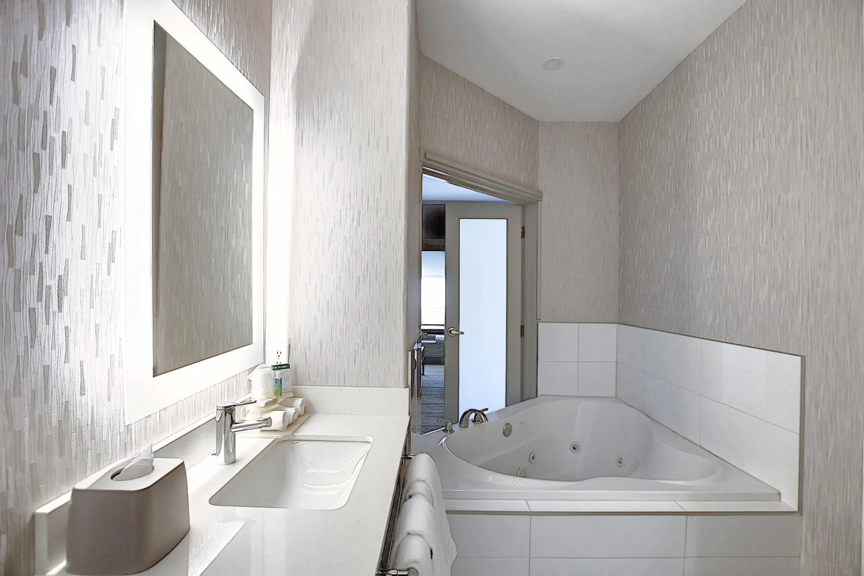 Bathroom in Holiday Inn Express Airport Calgary by IHG