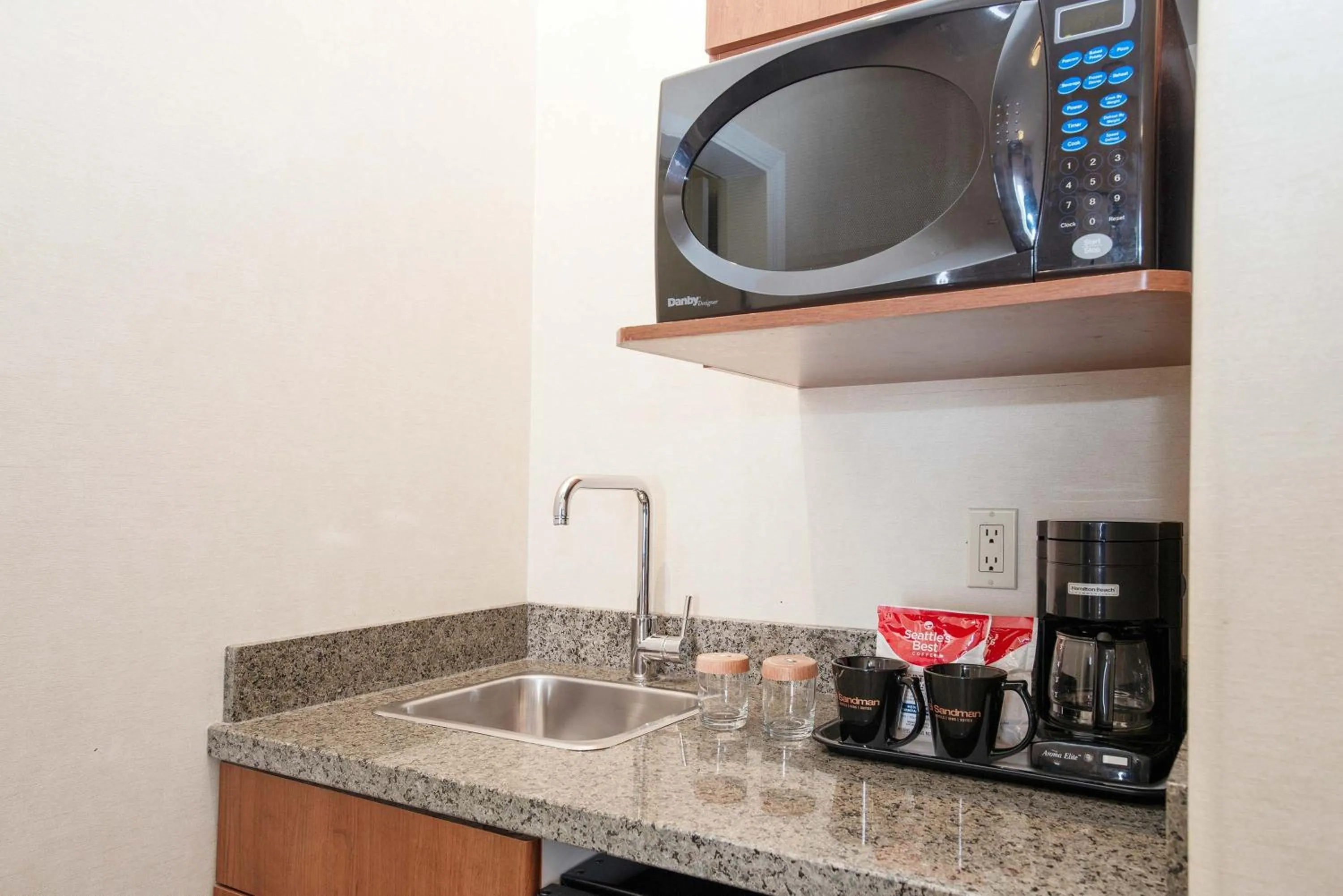 Kitchen or kitchenette in Sandman Hotel & Suites Calgary West