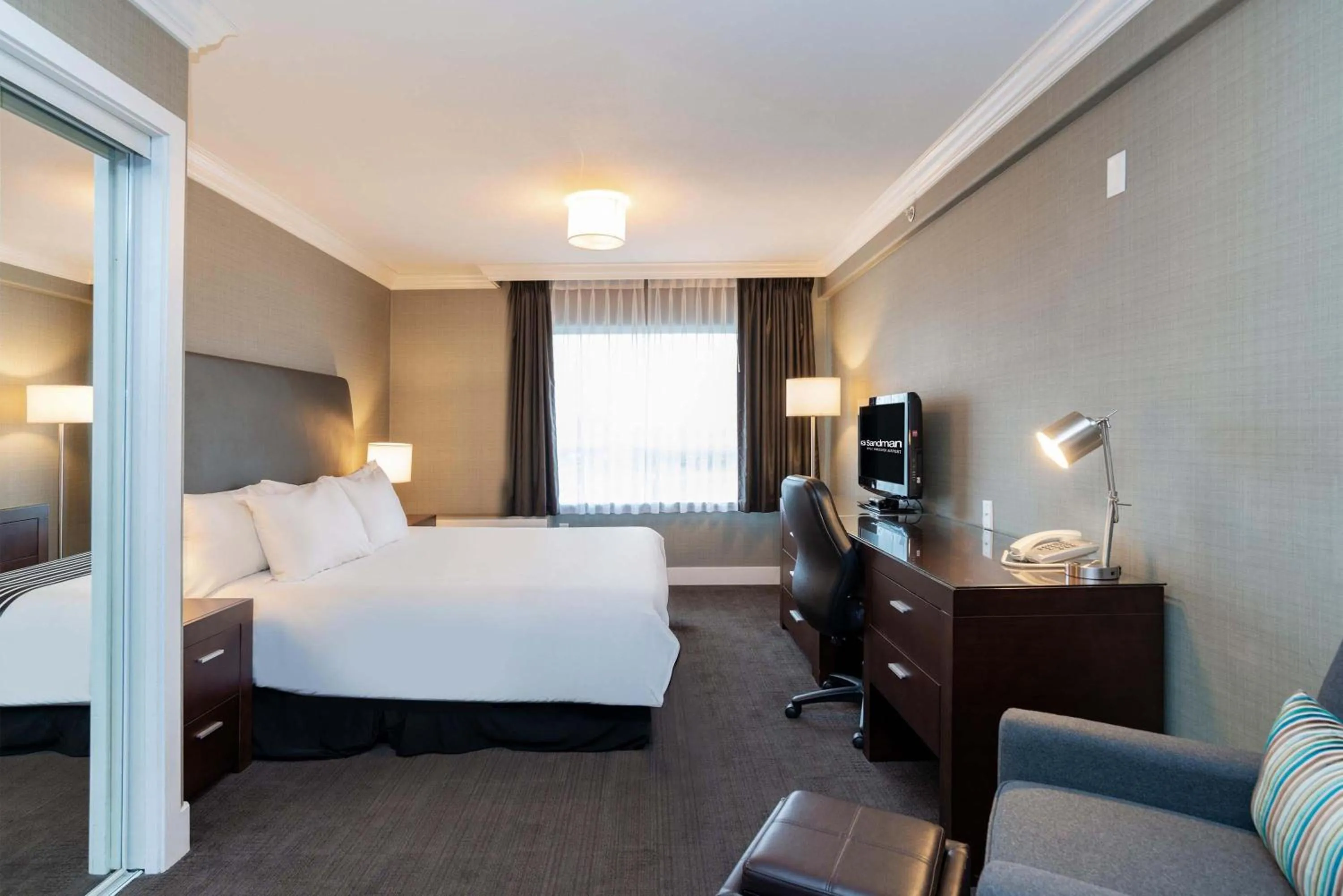 Photo of the whole room, Bed in Sandman Hotel Vancouver Airport