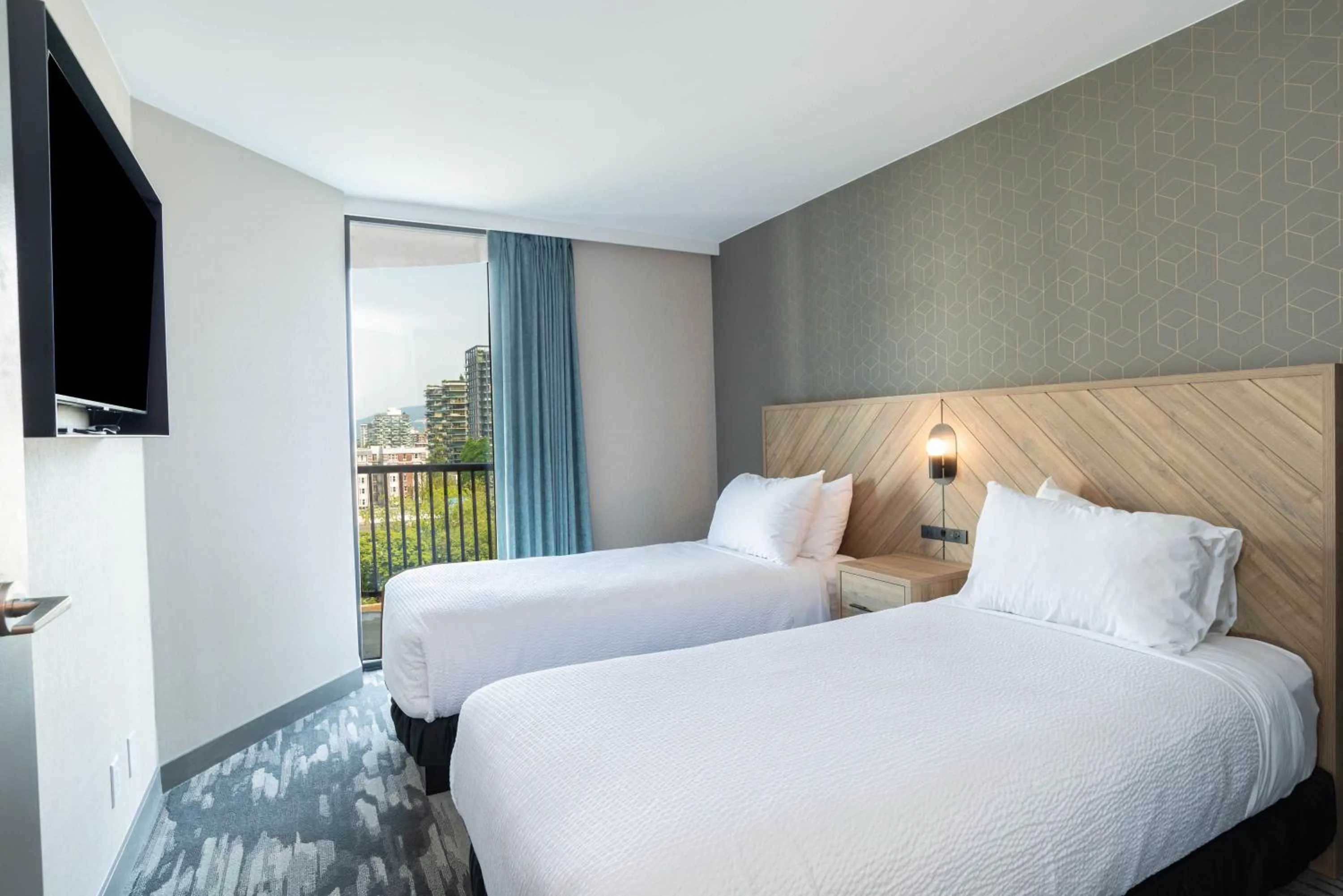 Photo of the whole room, Bed in Sandman Suites Vancouver on Davie