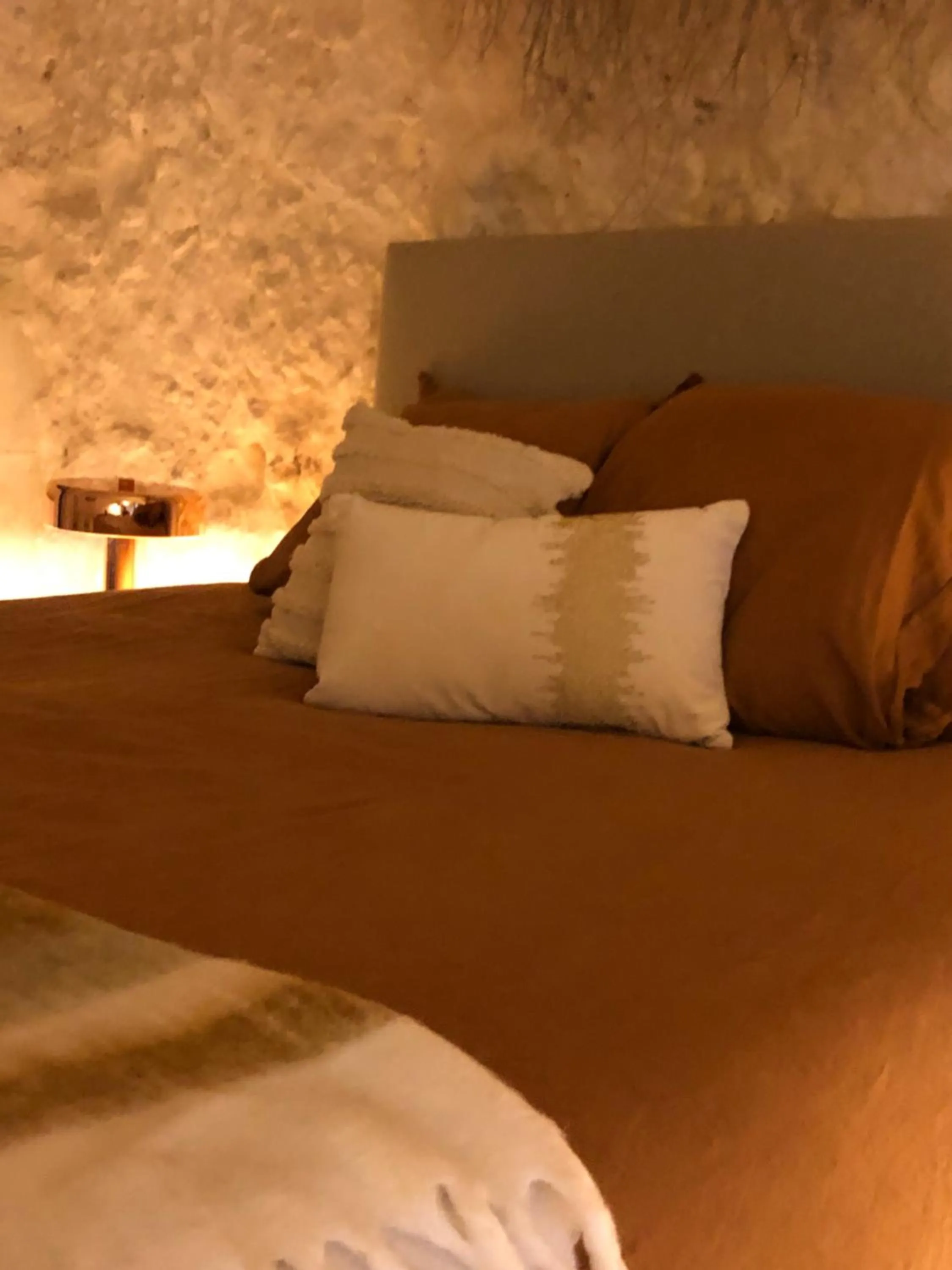 Bed in Les Troglos de la Tufolière