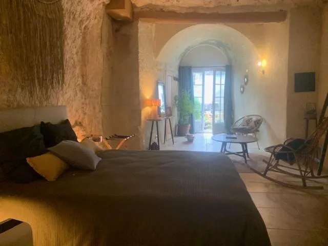 Bed in Les Troglos de la Tufolière