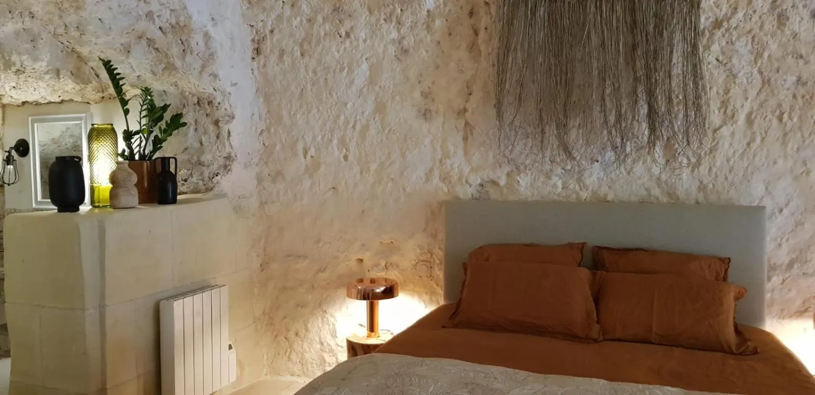 Bed in Les Troglos de la Tufolière