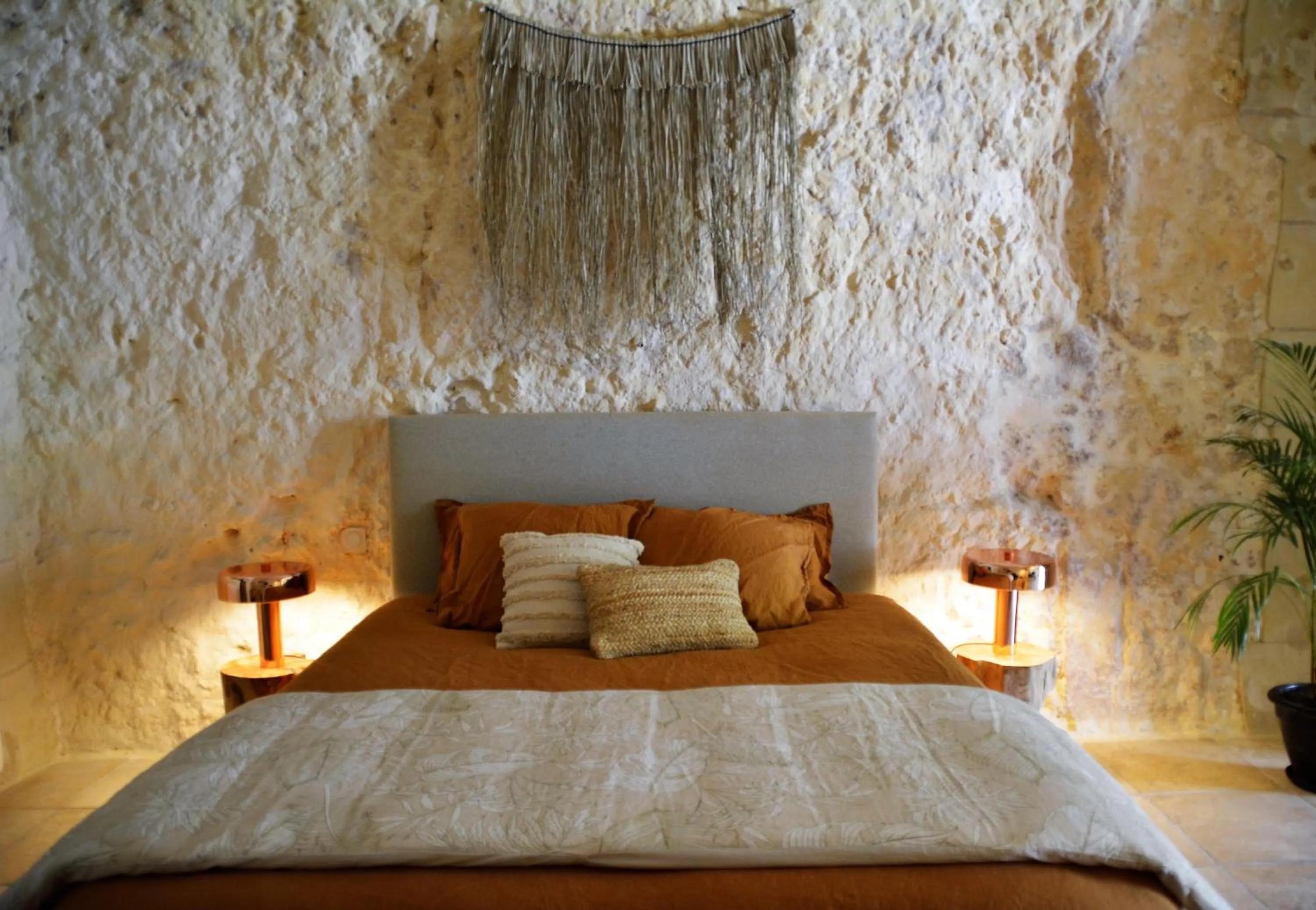 Bed in Les Troglos de la Tufolière