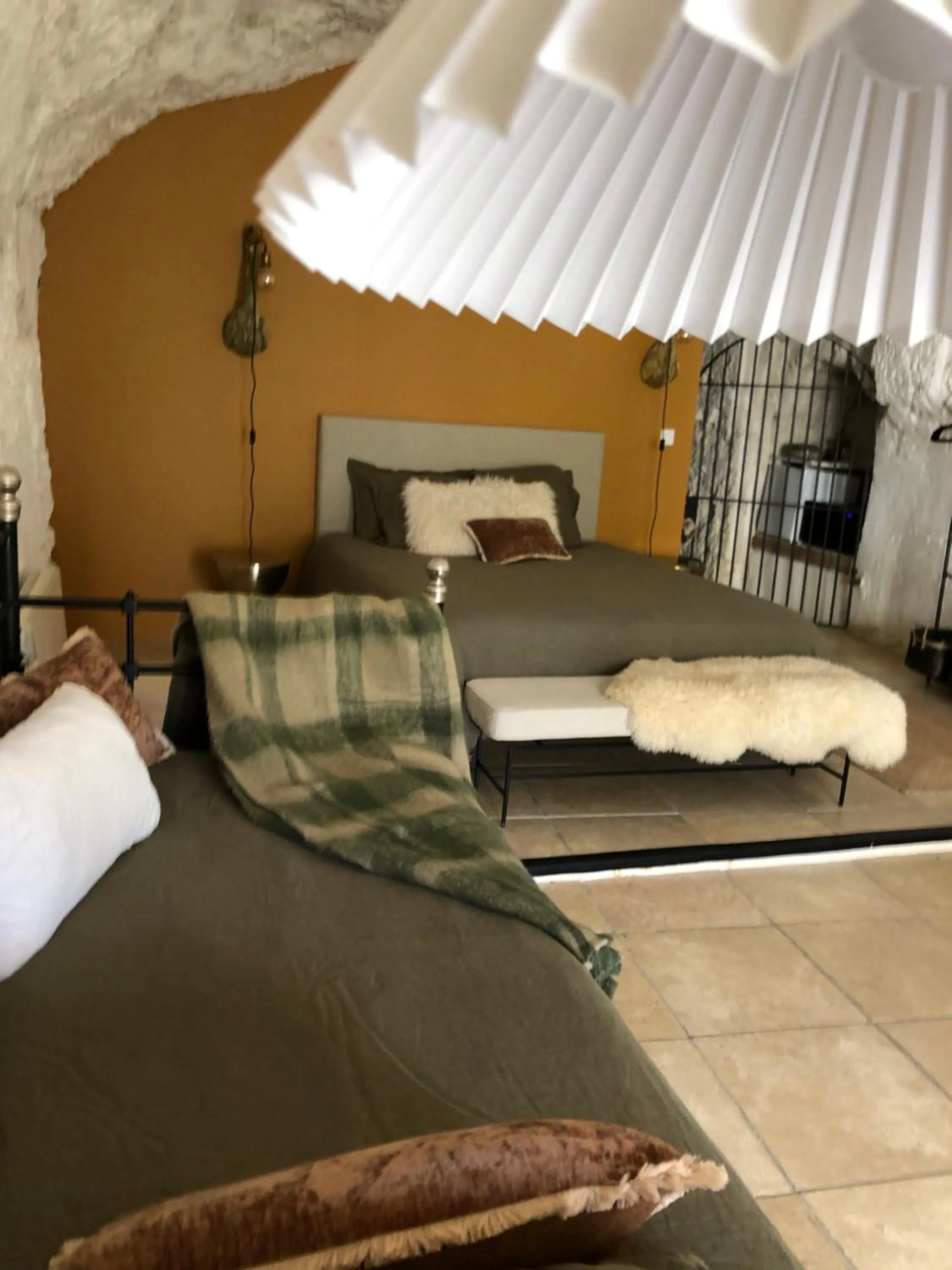 Bed in Les Troglos de la Tufolière