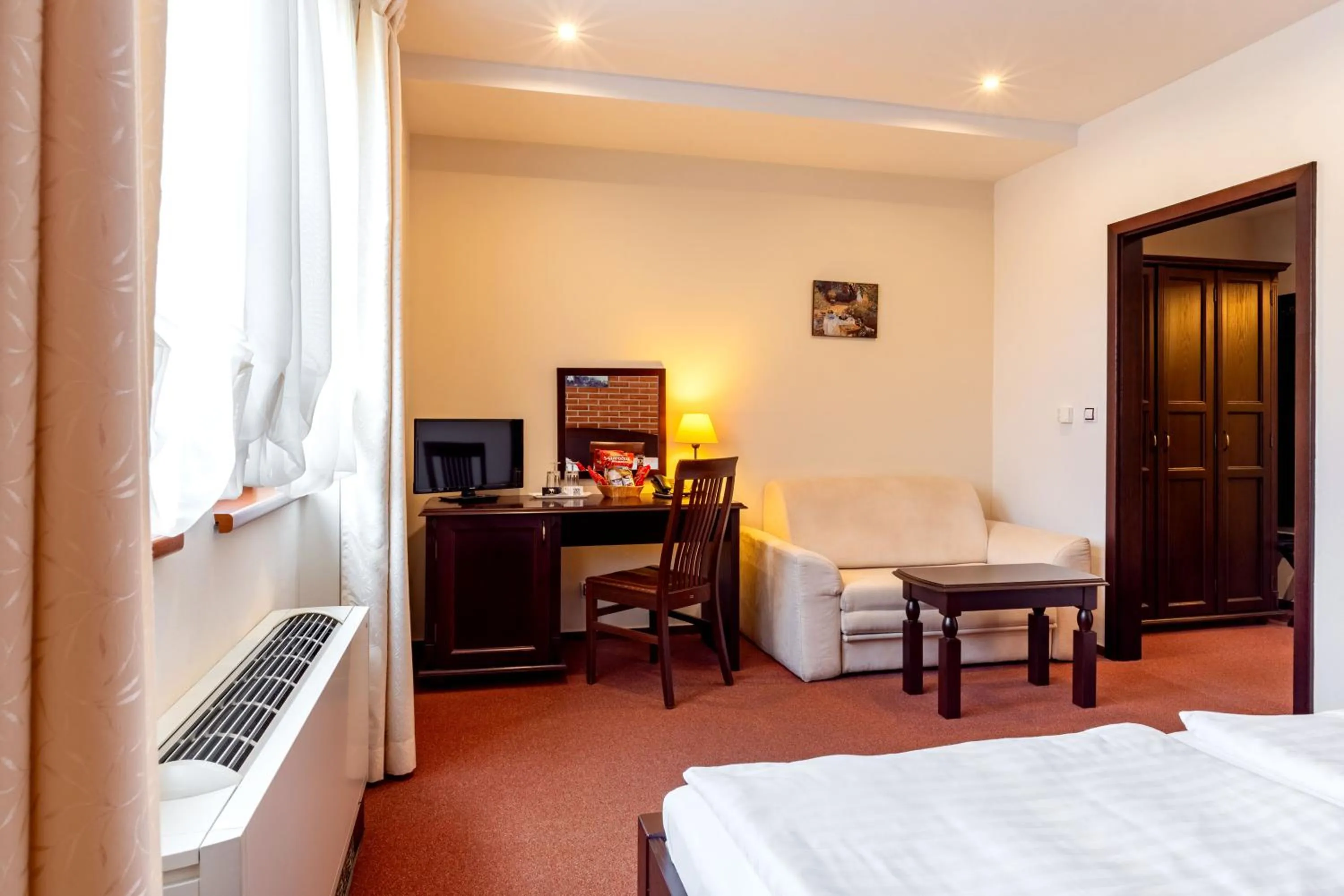 Living room, Bed in Hotel Purkmistr