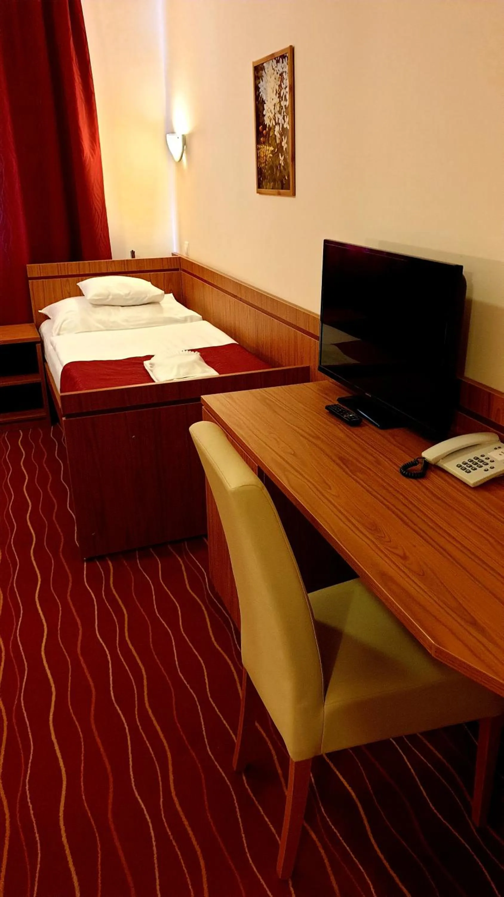 Bed in Diana Club Hotel