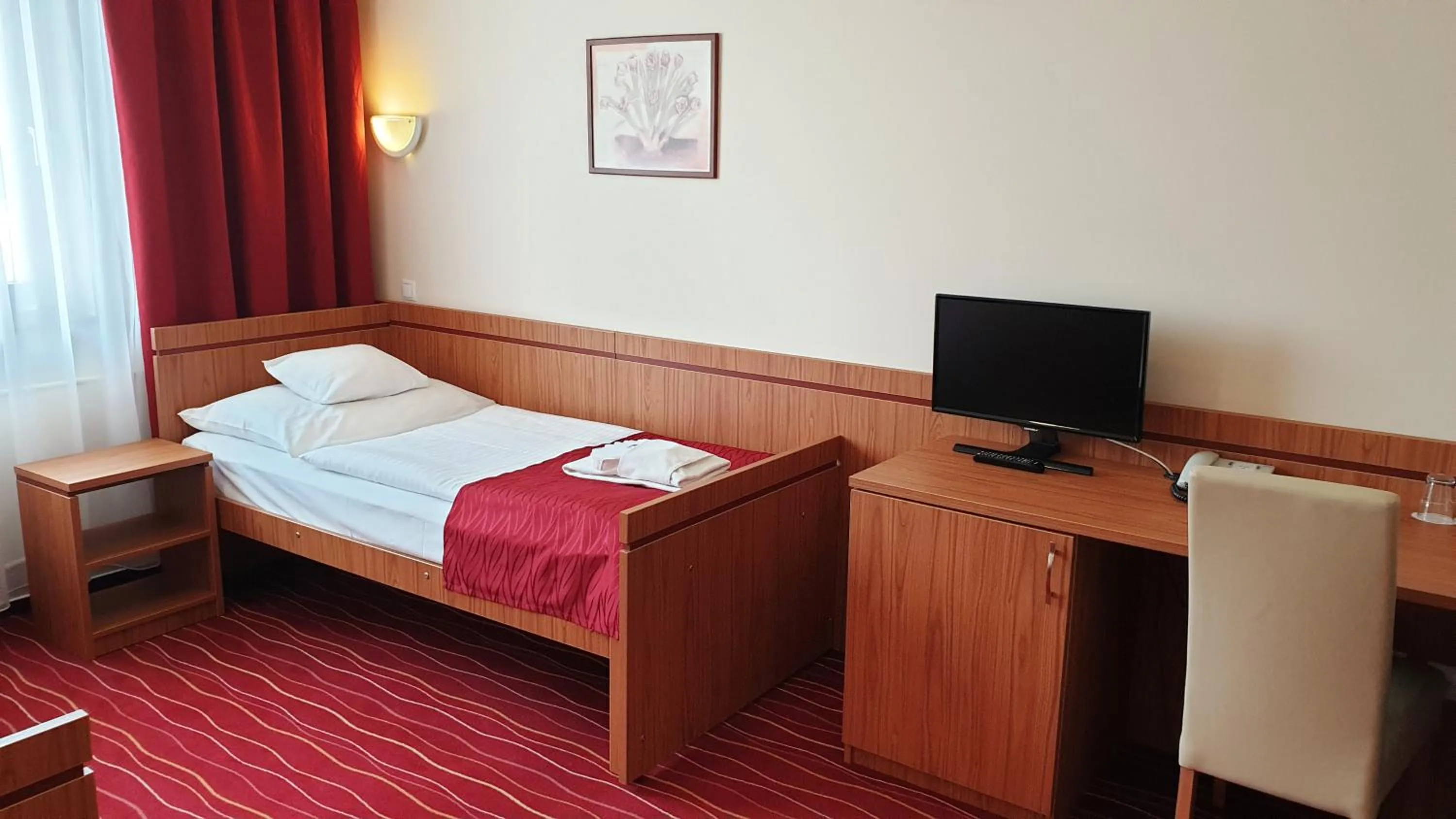 Bed in Diana Club Hotel