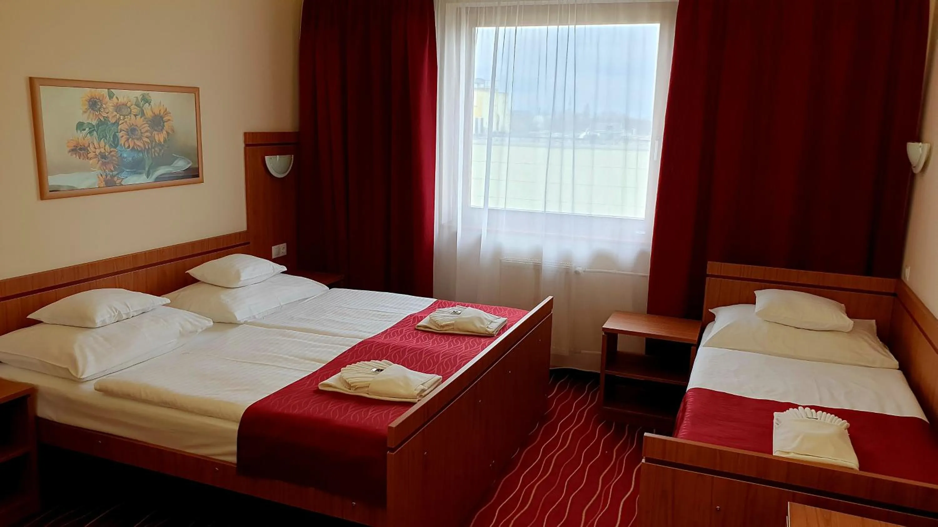 Bed in Diana Club Hotel