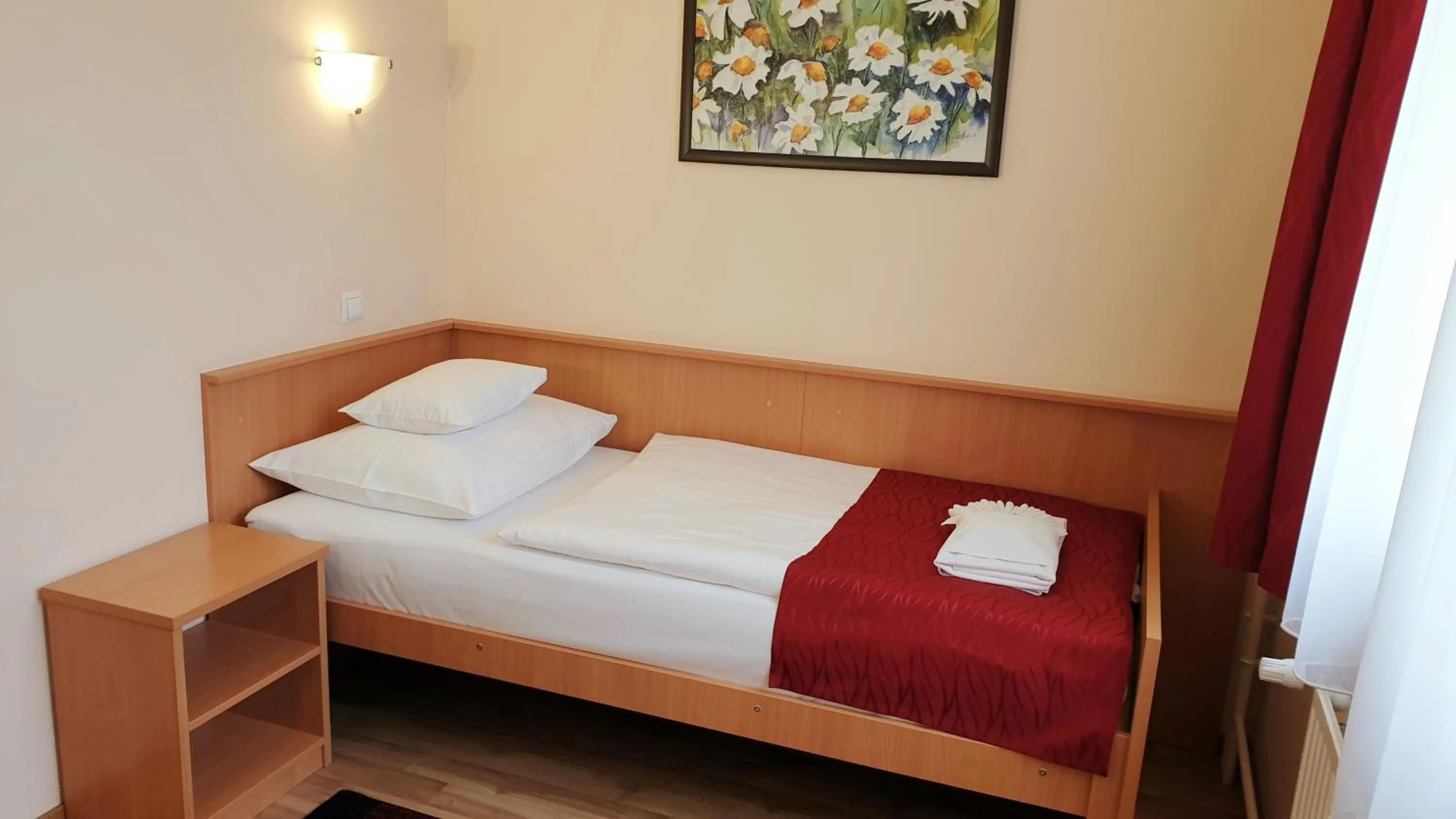 Bed in Diana Club Hotel