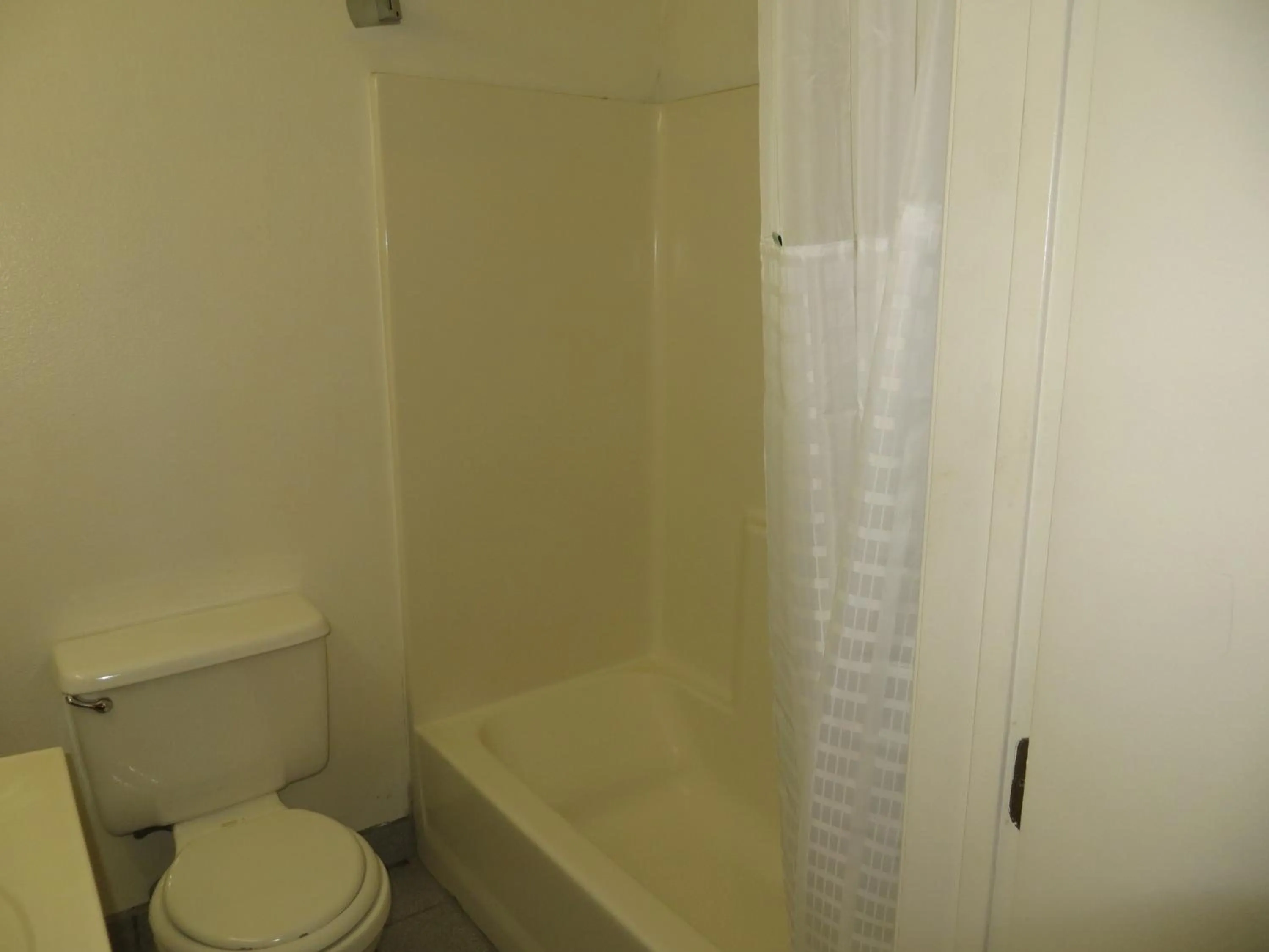 Toilet in Super 8 by Wyndham Hollywood/LA Area