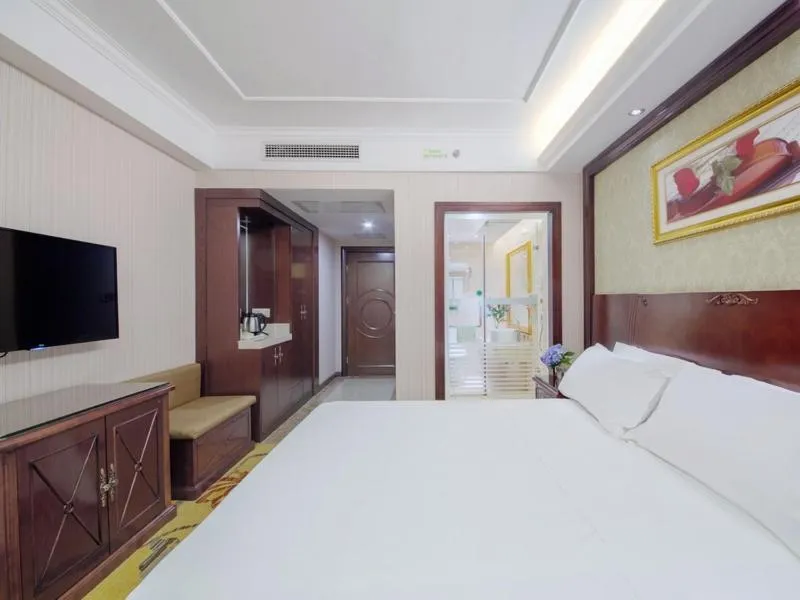 Bed in Vienna Hotel Guilin North High-Speed Railway Station Chengbei
