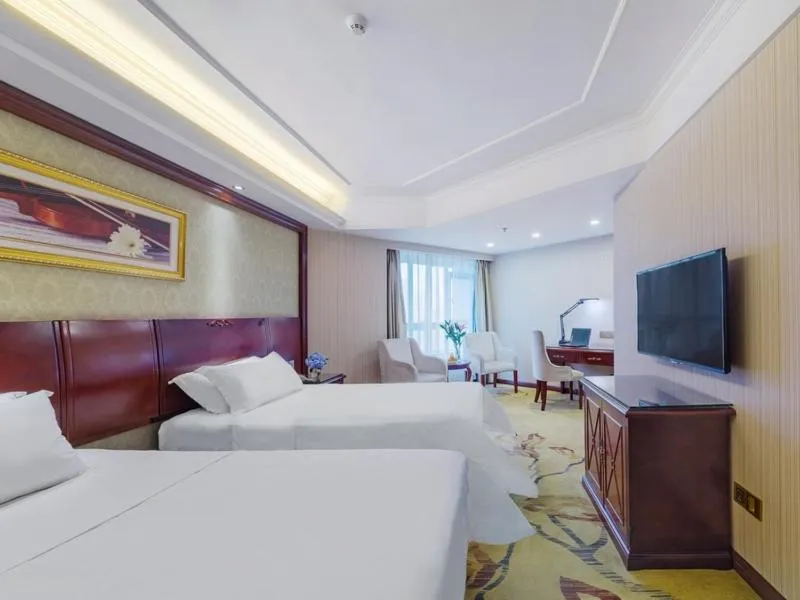 Bed in Vienna Hotel Guilin North High-Speed Railway Station Chengbei