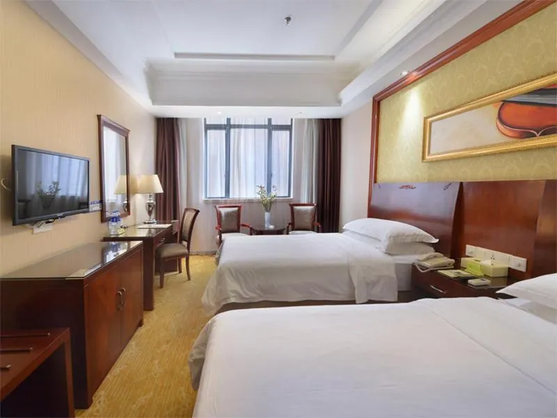 Bed in Vienna Hotel Guangzhou Tonghe