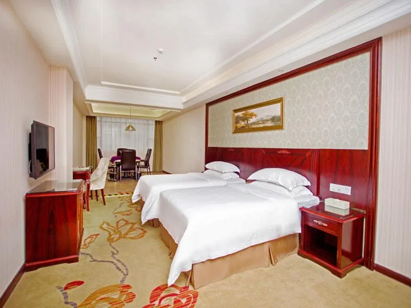 Bed in Vienna Hotel Shenzhen Shiyan Shilong Community