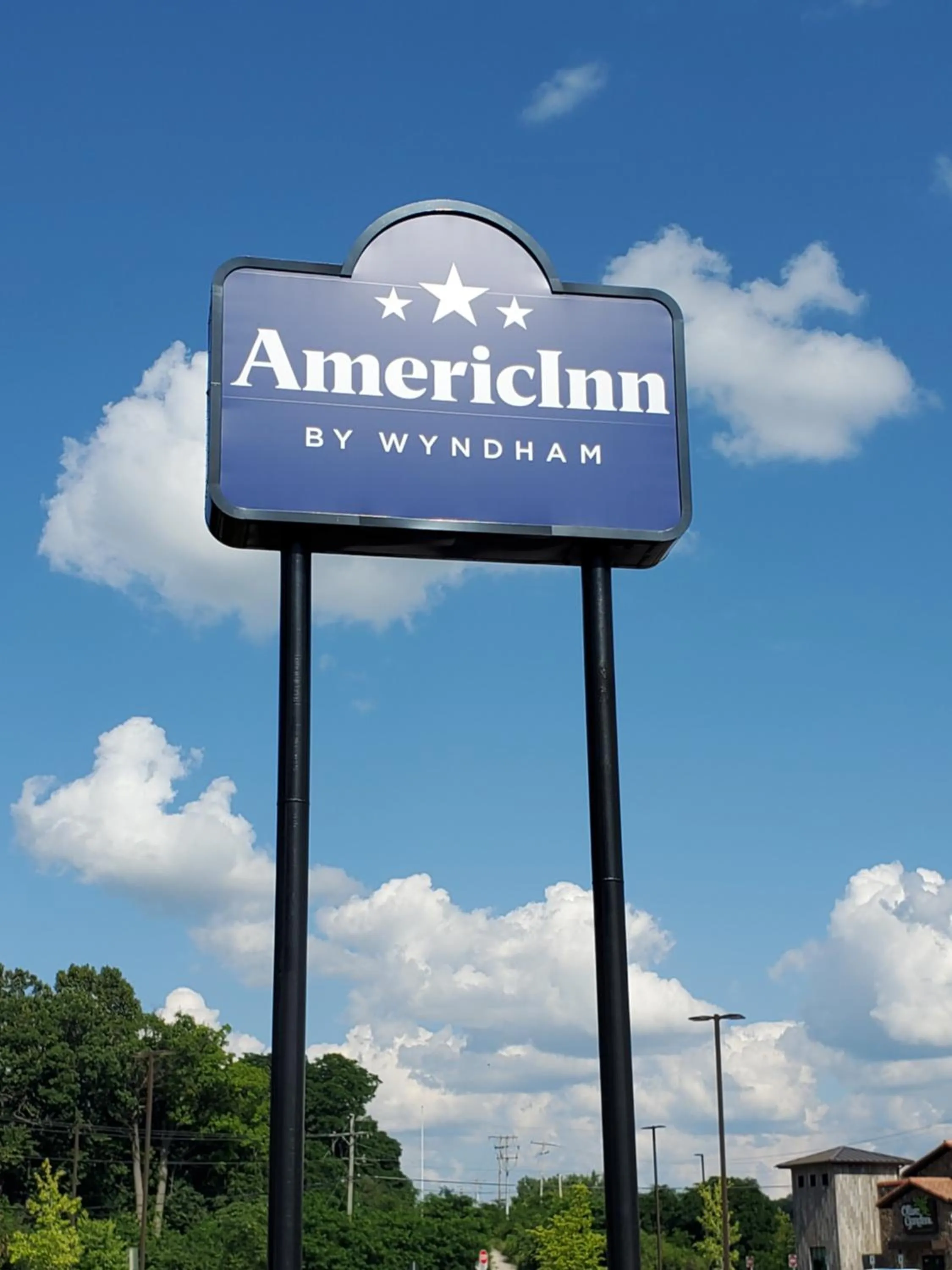 Property logo or sign in AmericInn and Suites by Wyndham Delafield-Waukesha-Milwaukee