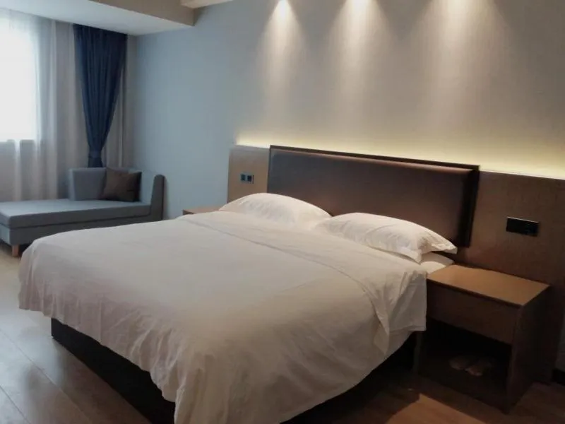 Bed in GreenTree Inn Jiangsu Suzhou Changshu Fuchunjiang International Qipeicheng Road Express Hotel