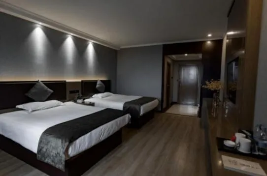 Bed in GreenTree Inn Jiangsu Suzhou Changshu Fuchunjiang International Qipeicheng Road Express Hotel