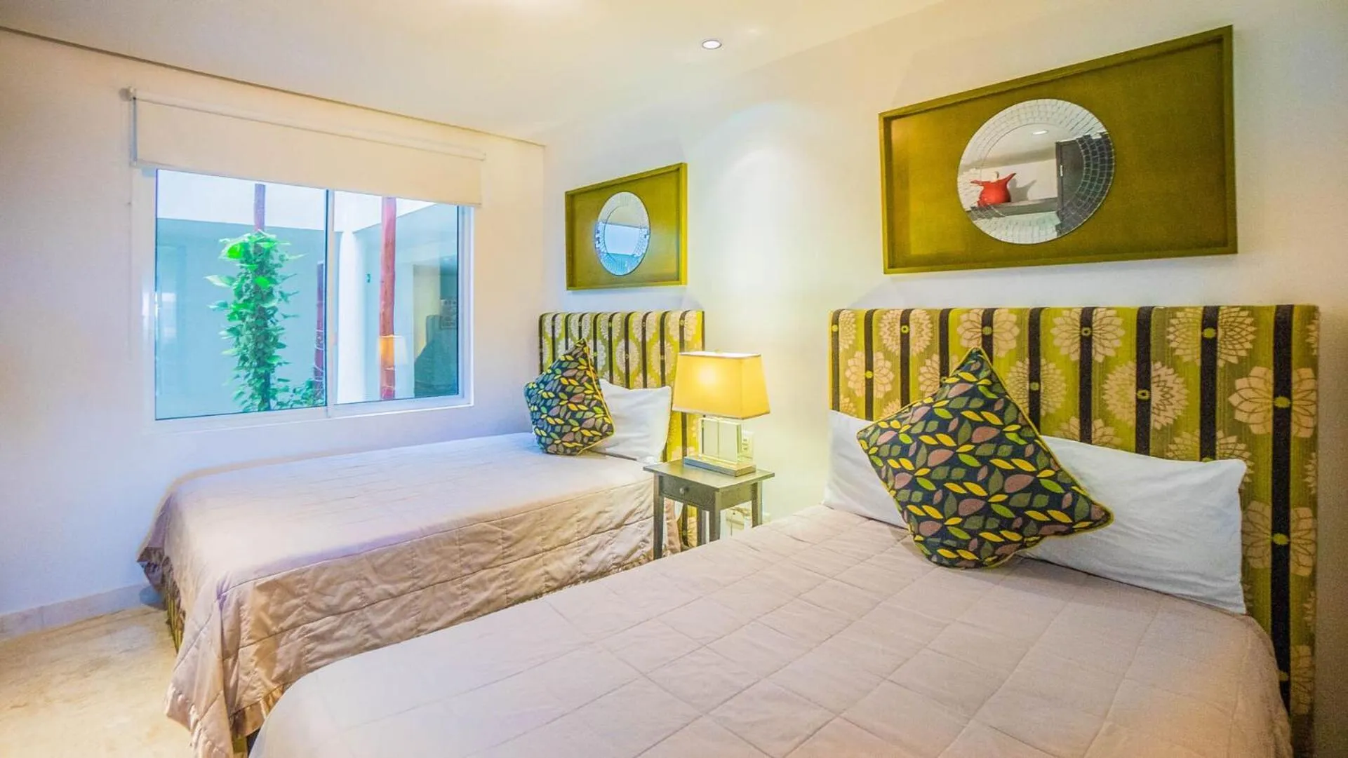 Bed in The Elements Oceanfront & Beachside Condo Hotel