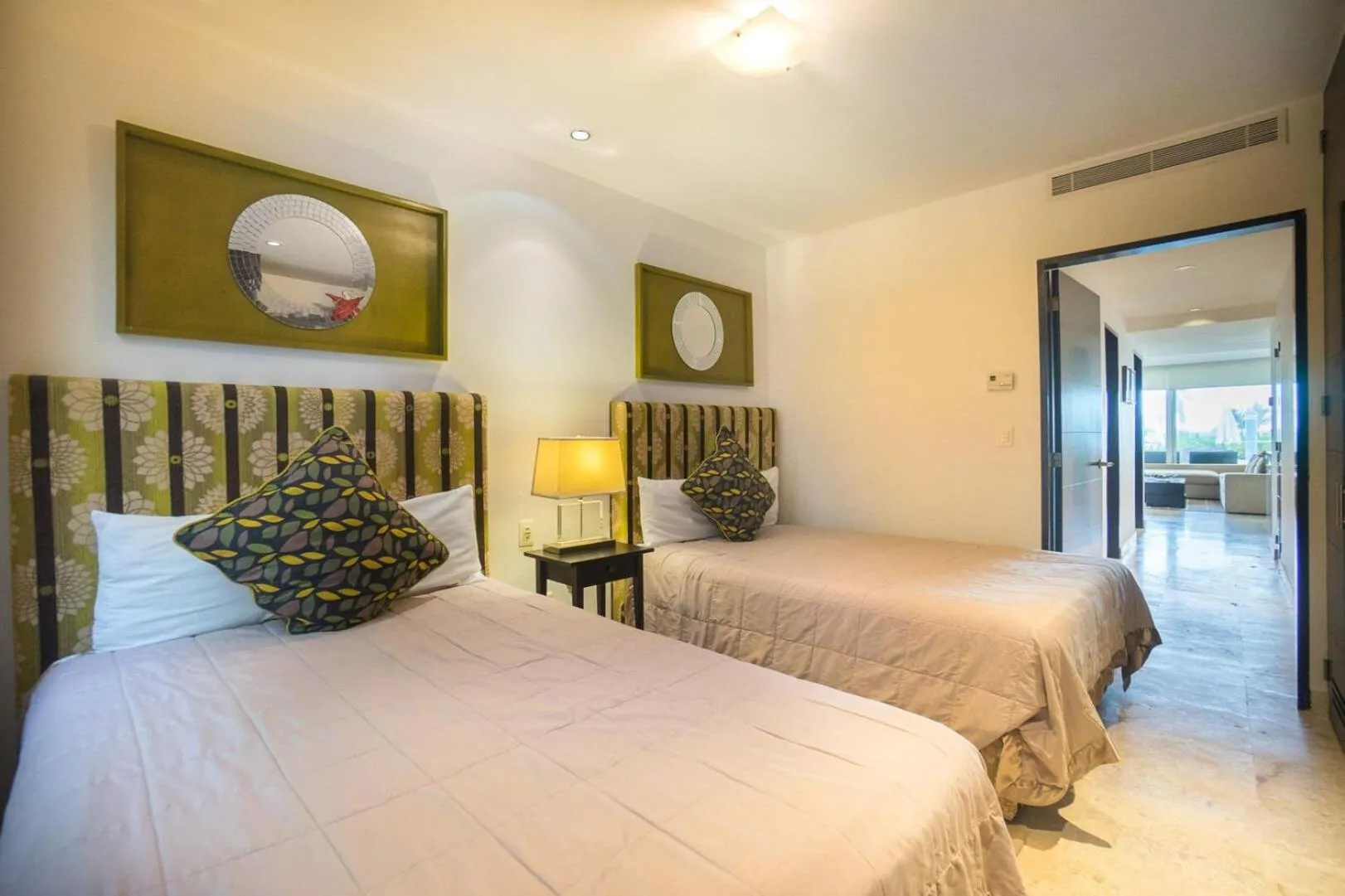 Bed in The Elements Oceanfront & Beachside Condo Hotel