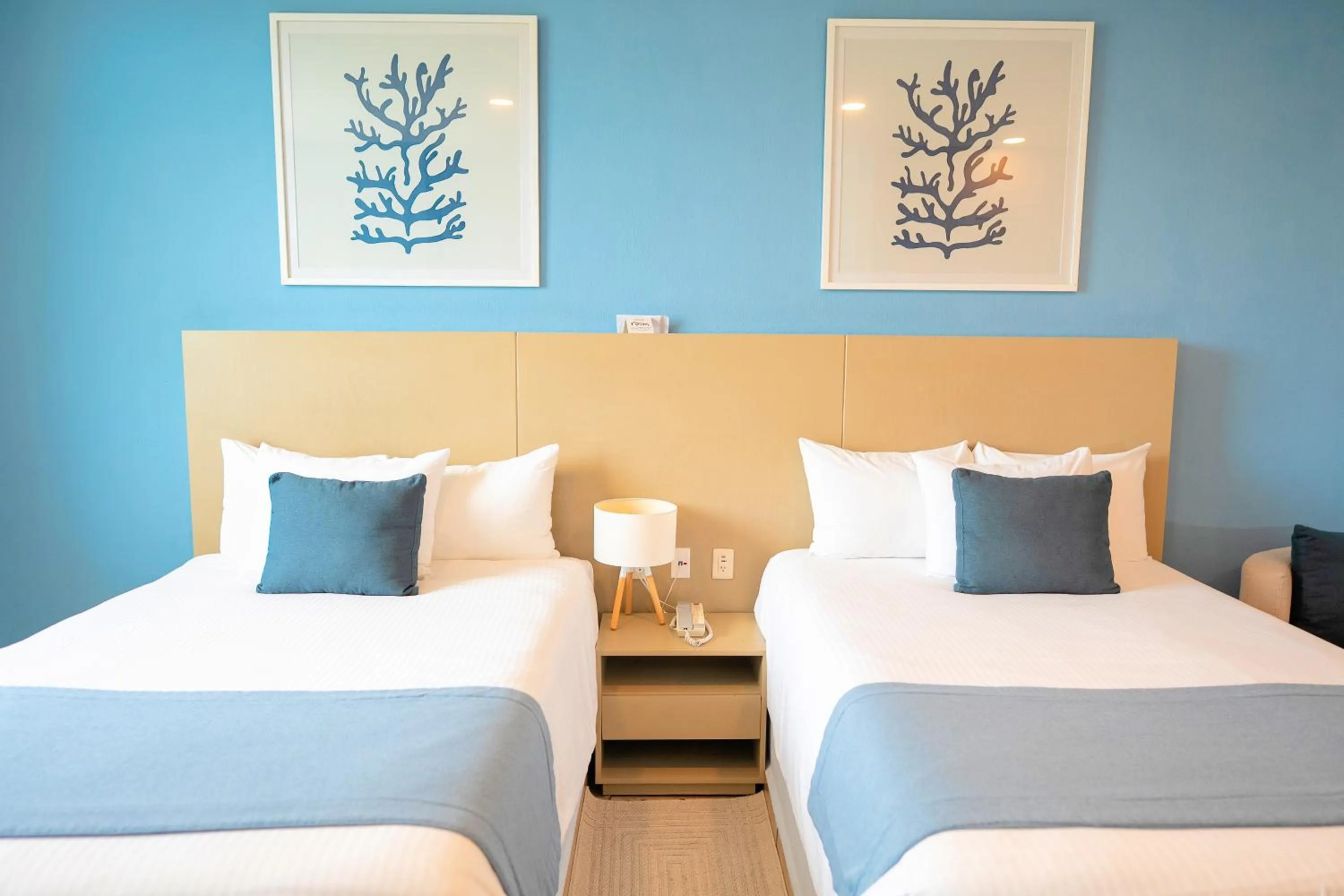 Bed in Ixchel Beach Hotel