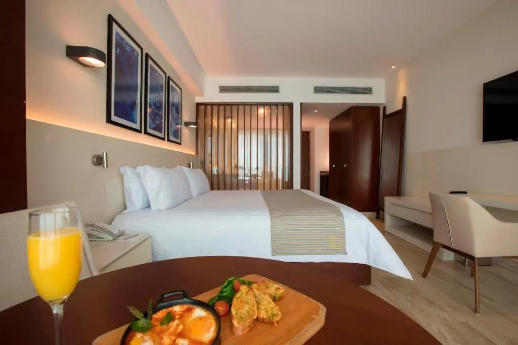 Bed in Krystal Grand Cancun All Inclusive