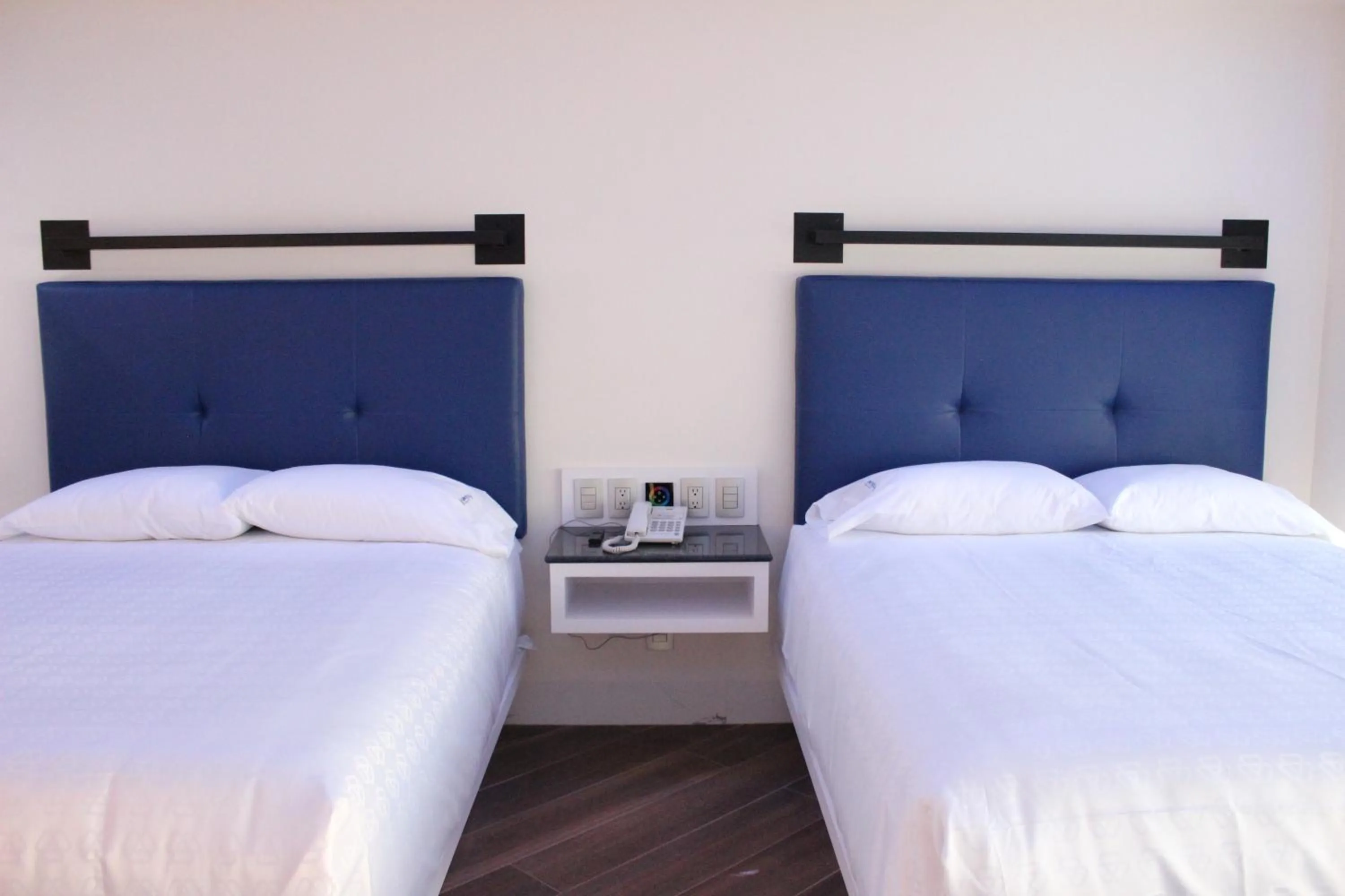 Bed in WeEnjoy Hotels Grand Prix Aeropuerto CDMX