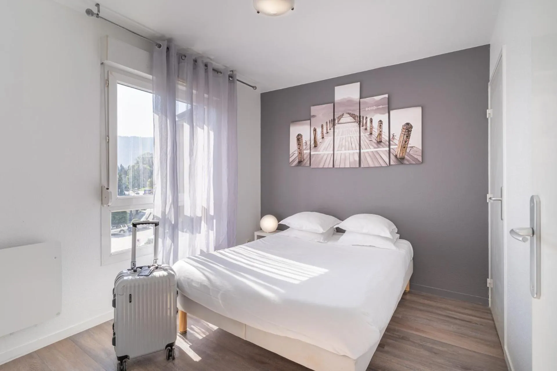 Bedroom, Bed in Séjours & Affaires Annecy Le Pont Neuf