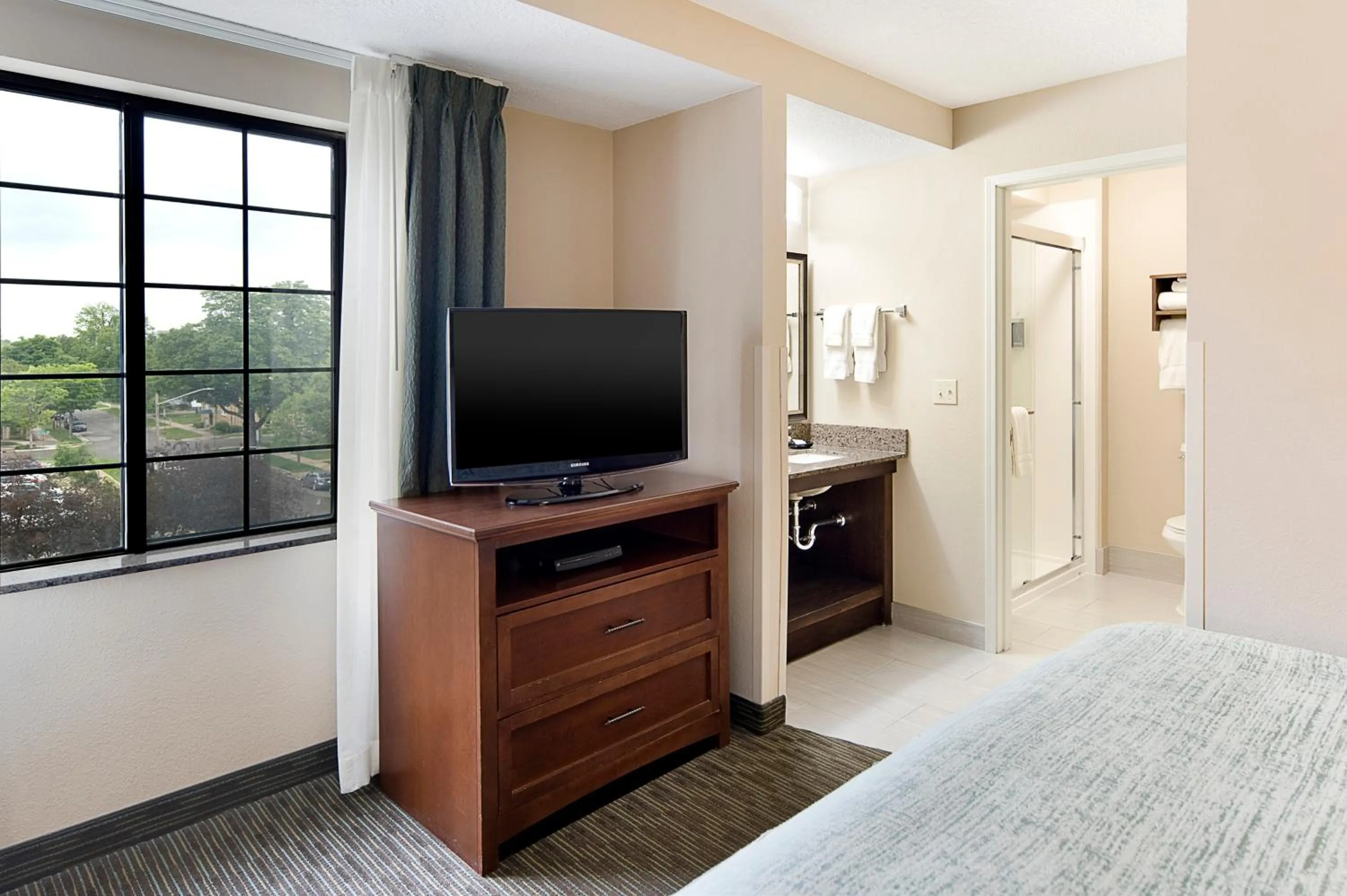 Bed in Aspen Suites - Rochester