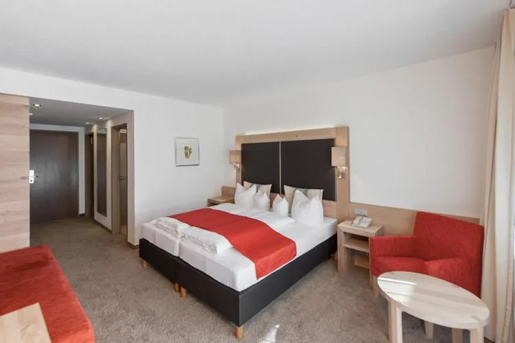 Bed in Hotel Tyrolerhof