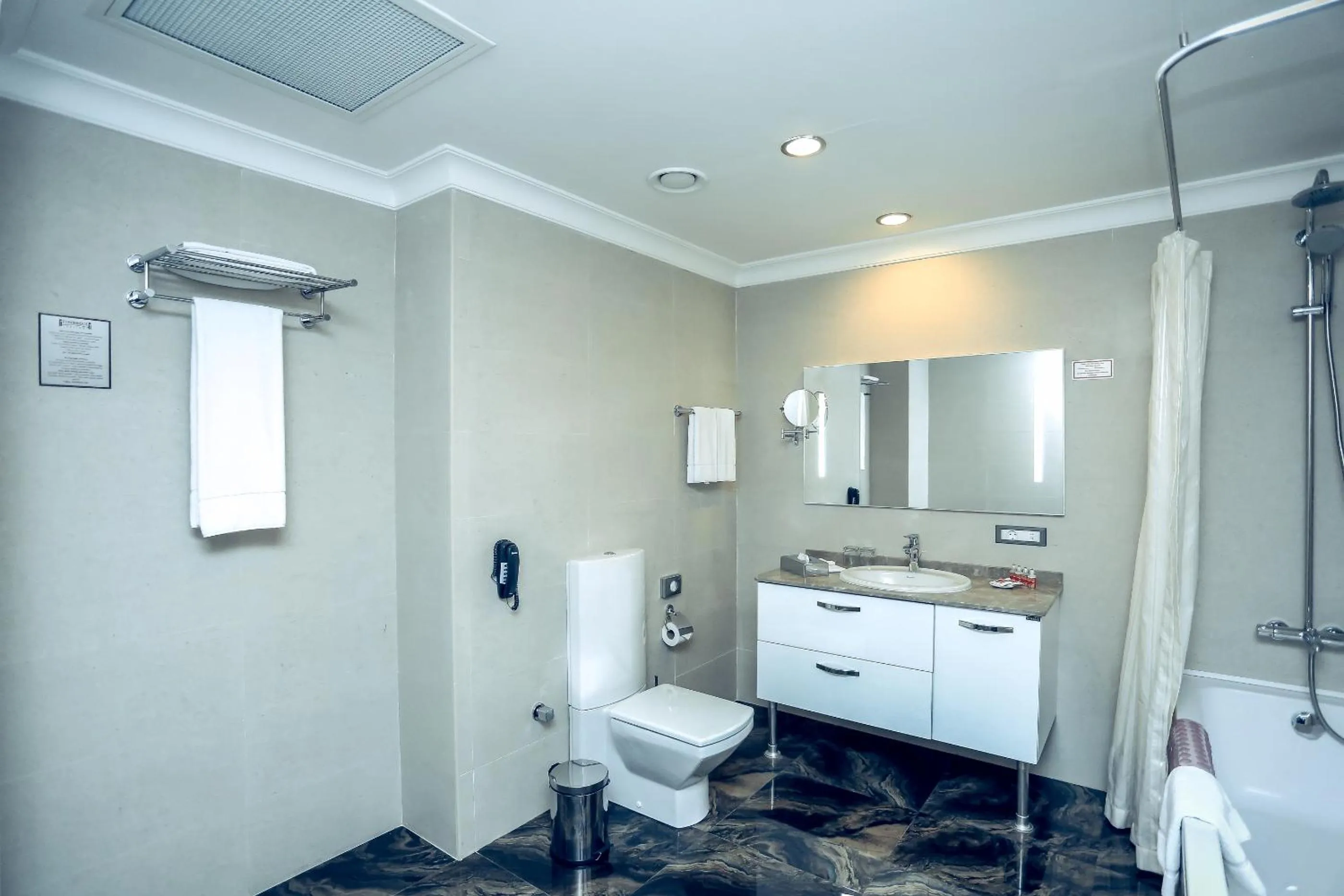 Bathroom in Parkside Hotel & Apartments