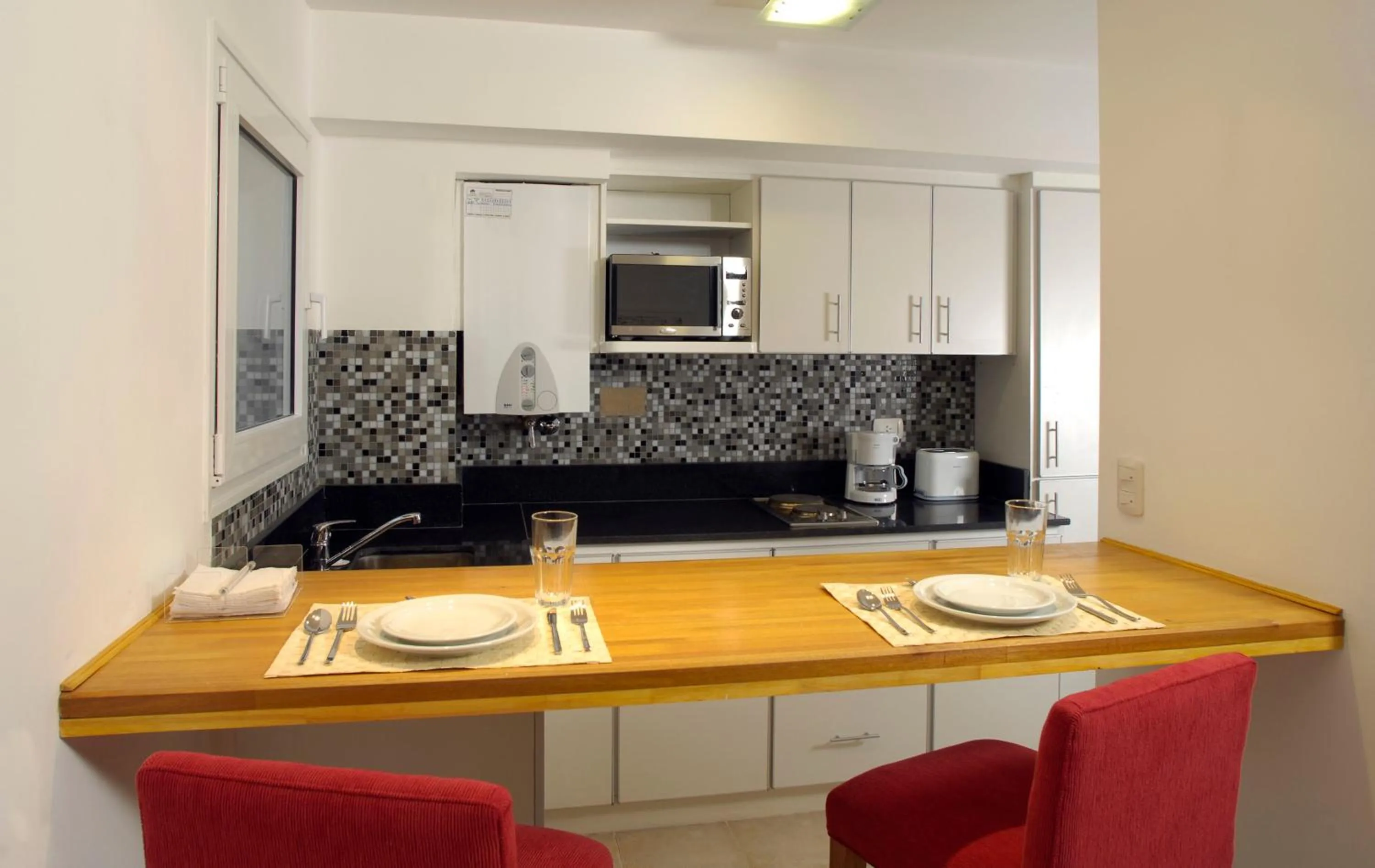 Kitchen or kitchenette in Cilene del Faro Suites & Spa
