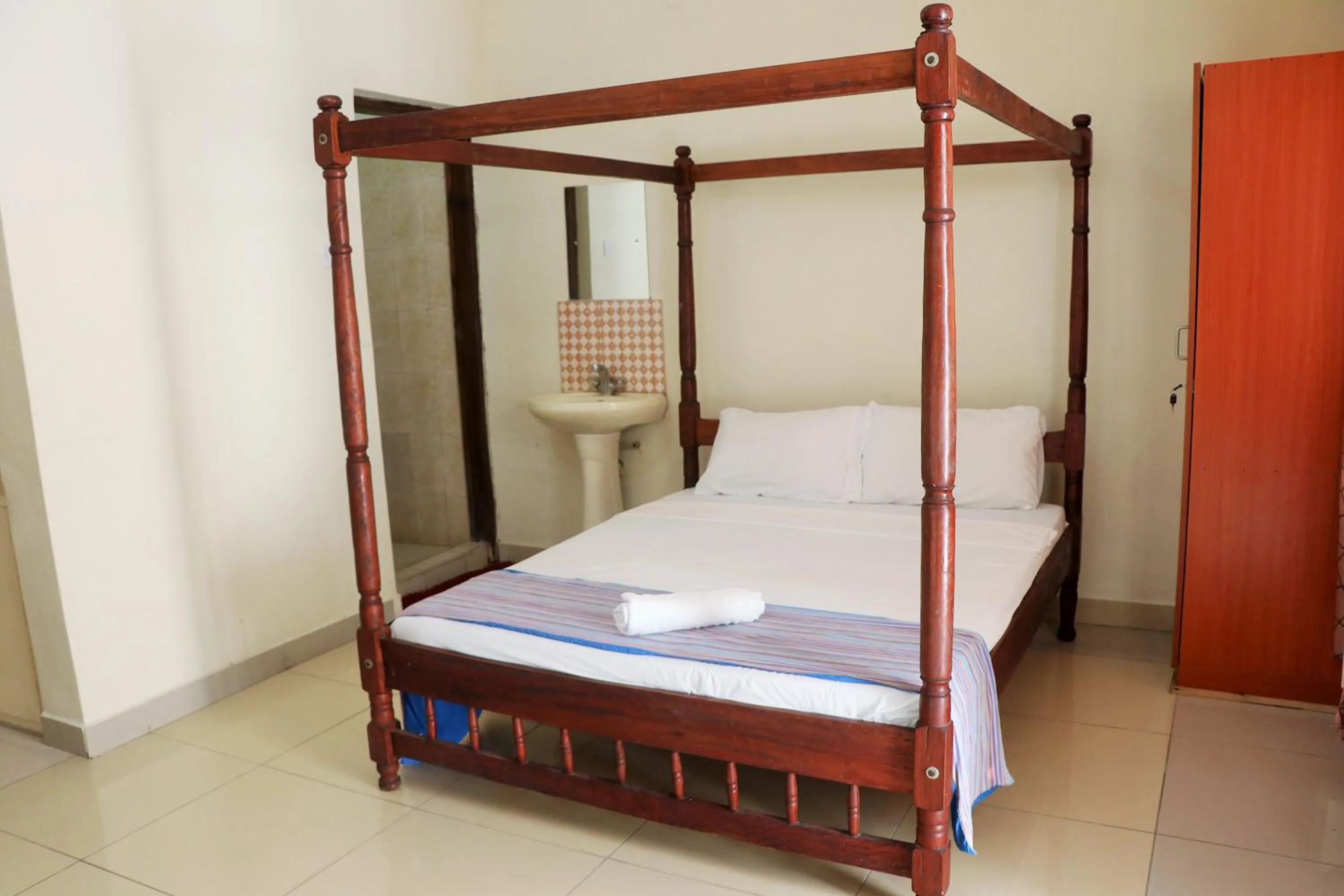 Bed in Sanana Conference Center and Holiday Resort