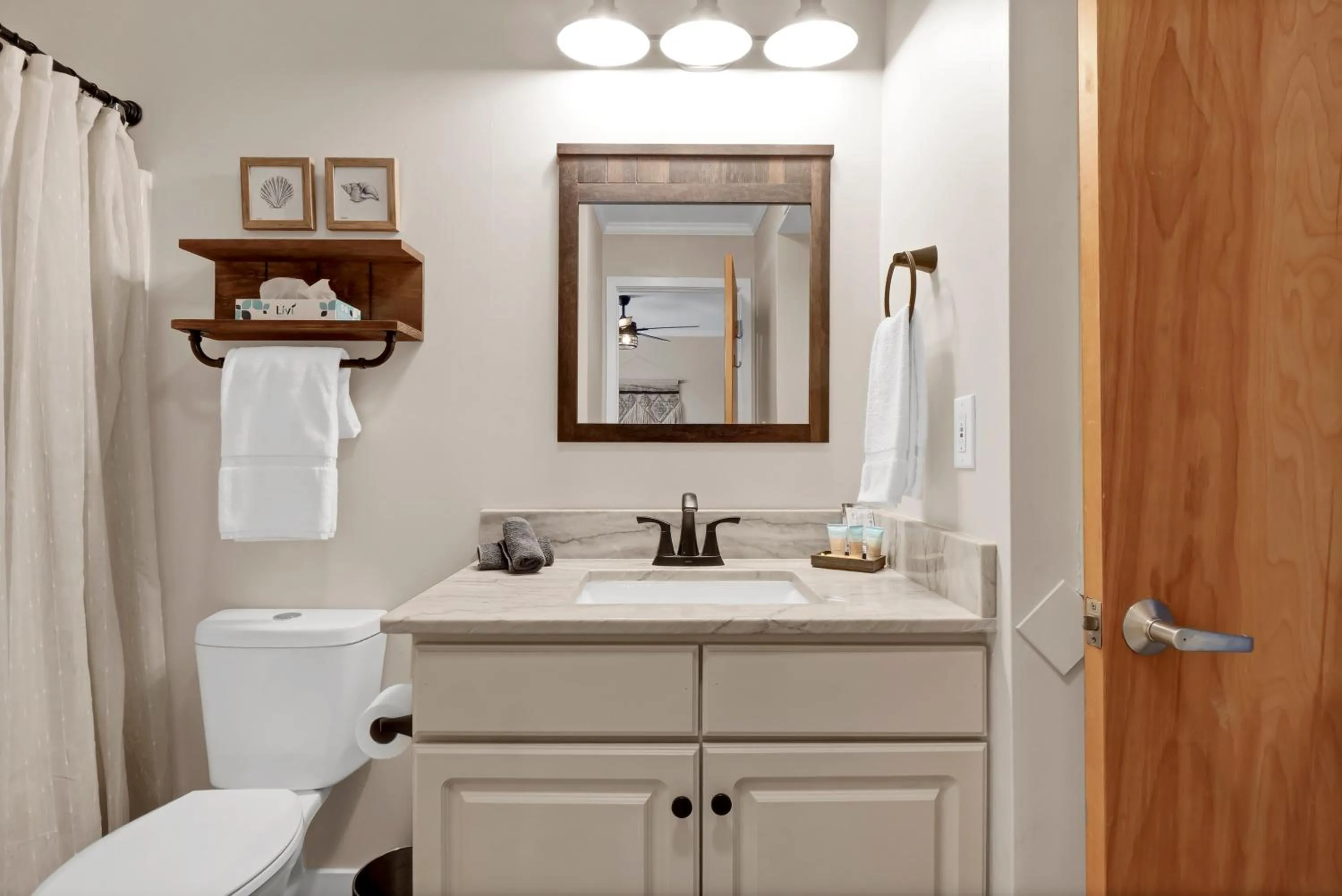 Toilet in Sandpeddler Inn and Suites