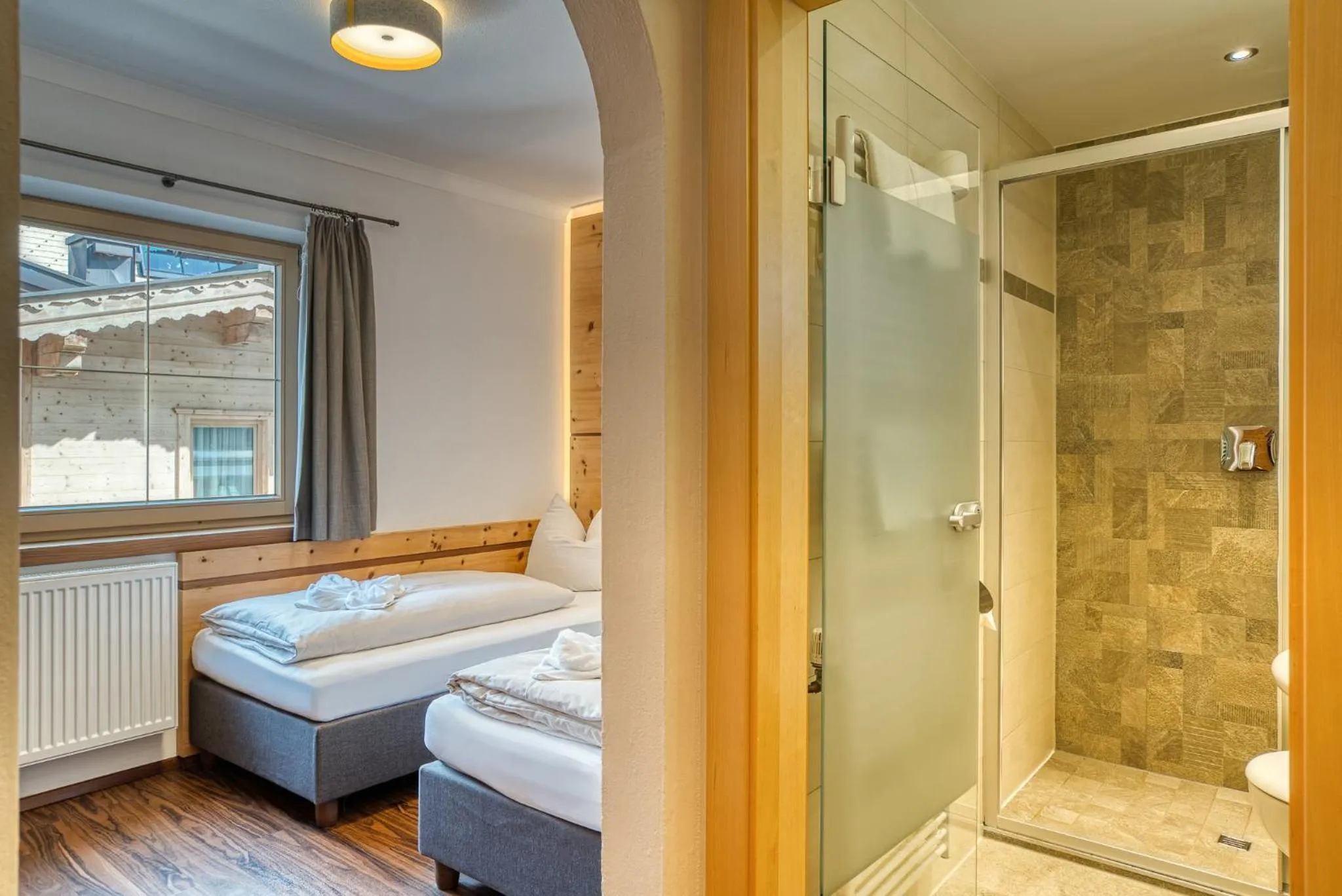 Photo of the whole room, Bed in SonnenHOF hotel gerlos centrum