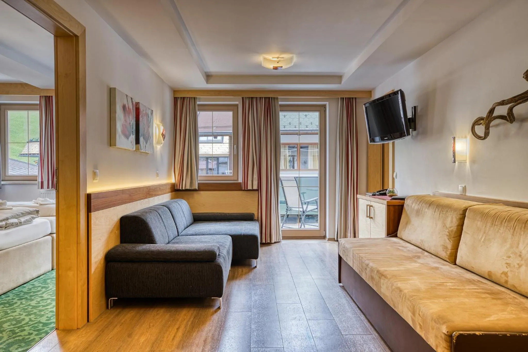 Seating area, Bed in SonnenHOF hotel gerlos centrum