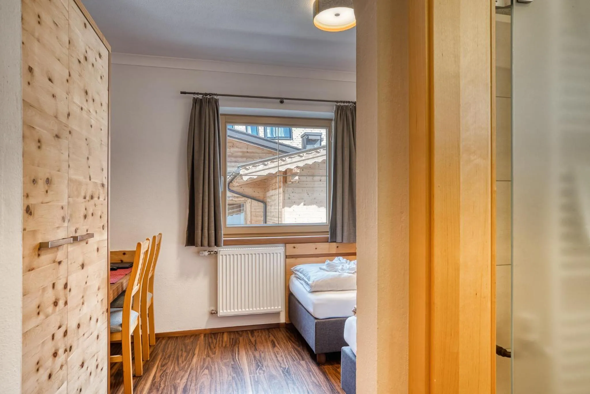 Photo of the whole room, Bed in SonnenHOF hotel gerlos centrum