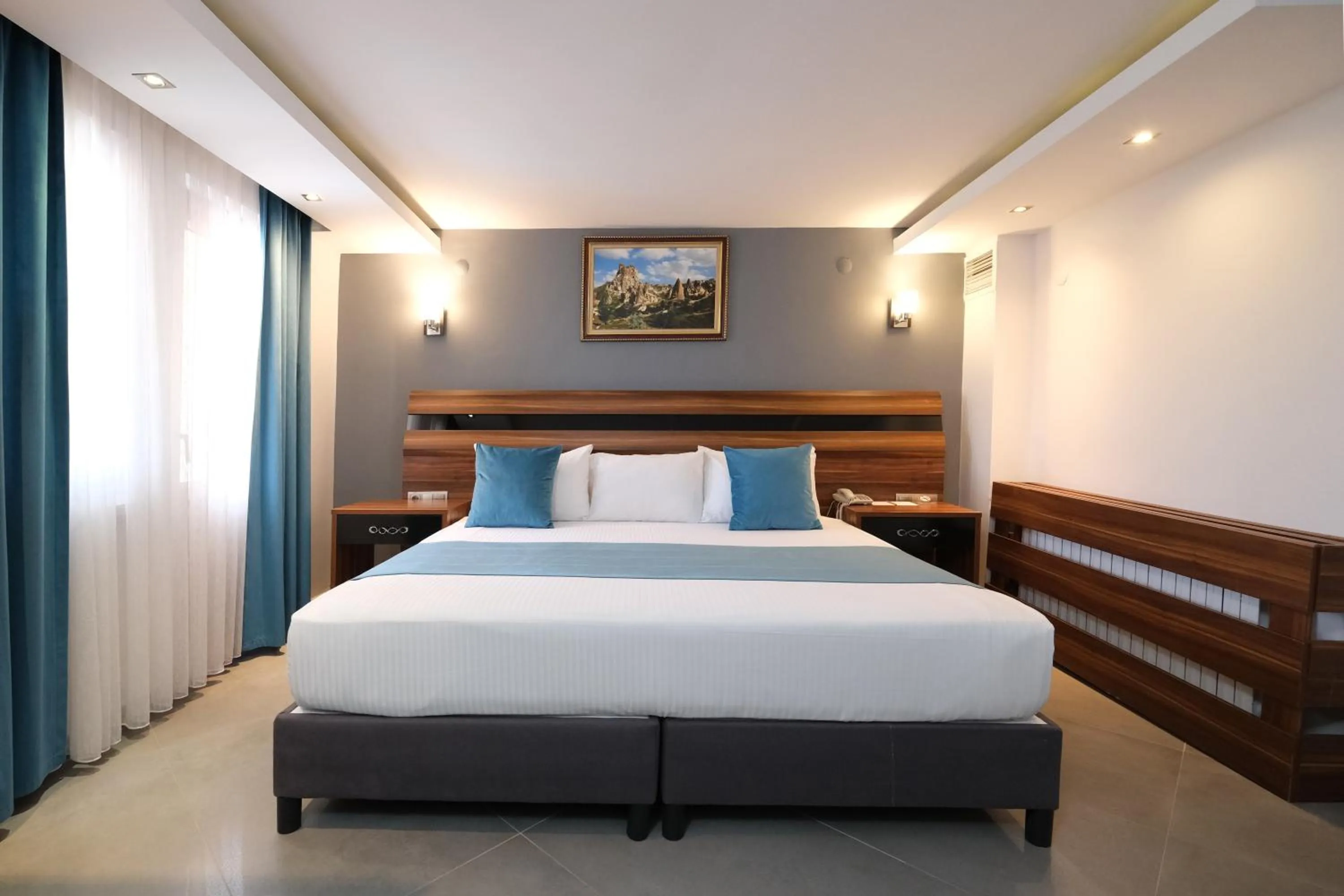 Bed in SIGNATURE GARDEN AVANOS Hotel & SPA